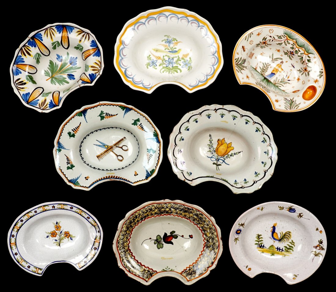 Collection of 8 French Faience Shaving Bowls: An assembled collection of eight 18th / 19th Century shaving bowls, largest 2.75" h x 12"". Condition: Chips, cracks, and repairs to be expected.
