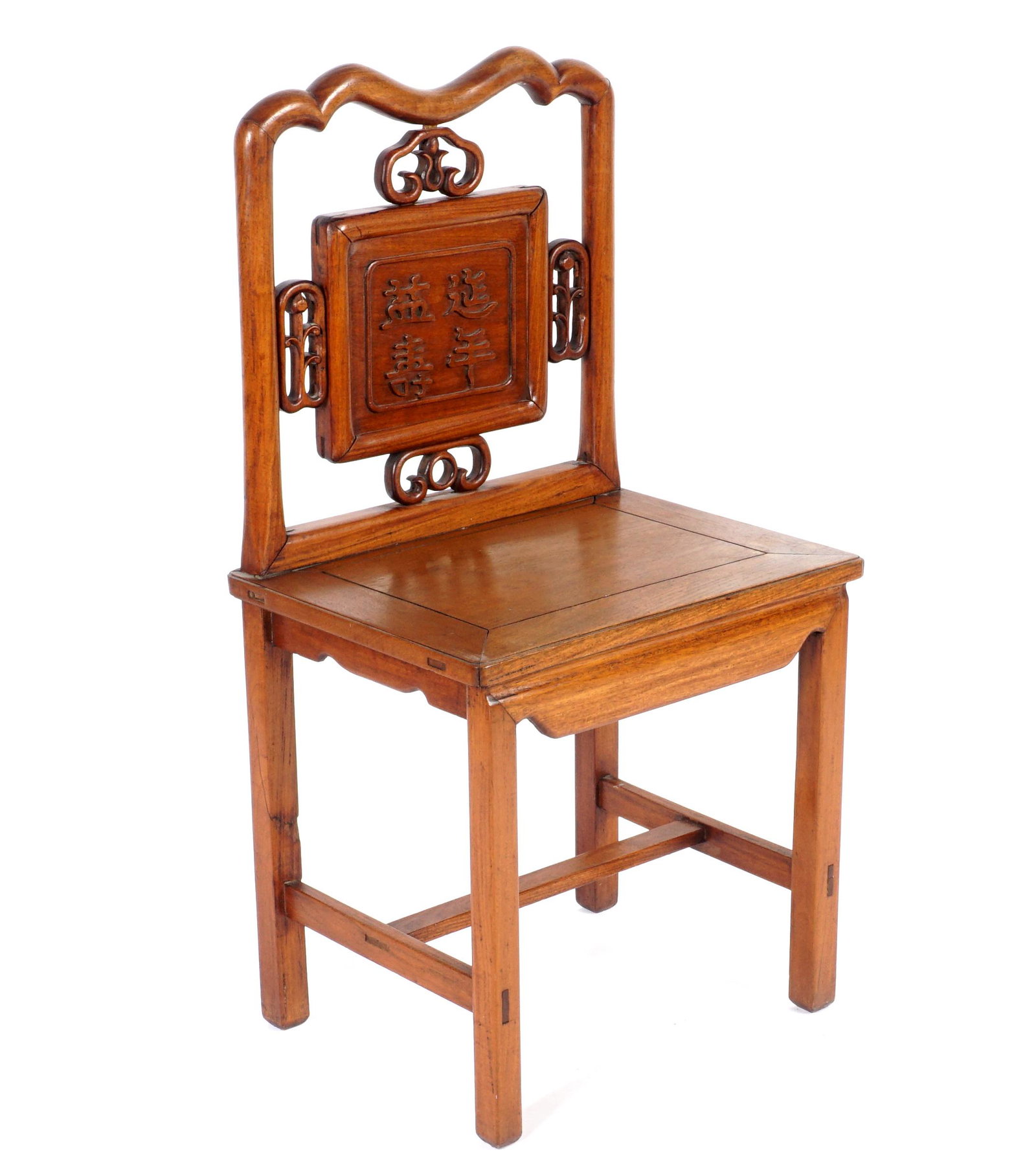 Carved Chinese Side Chair: Late 19th / Early 20th Century, elm frame, shaped top rail, back with carved kanji central medallion, pierced carved accents, shaped skirt, straight legs, through tenon construction. Overall 40.5" h.
