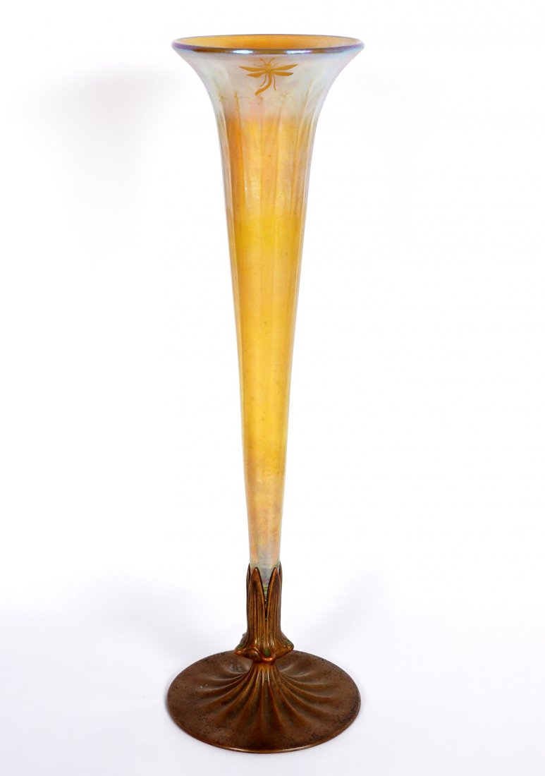 Tiffany Furnace Favrile Bud Vase & Stand 158: Large tapered favrile glass trumpet vase, flared rim, tapered ribbed body, etched dragonfly at throat most likely applied later, marked L.C.T. Favrile. Bronze base well marked with Louis C. Tiffany Fu