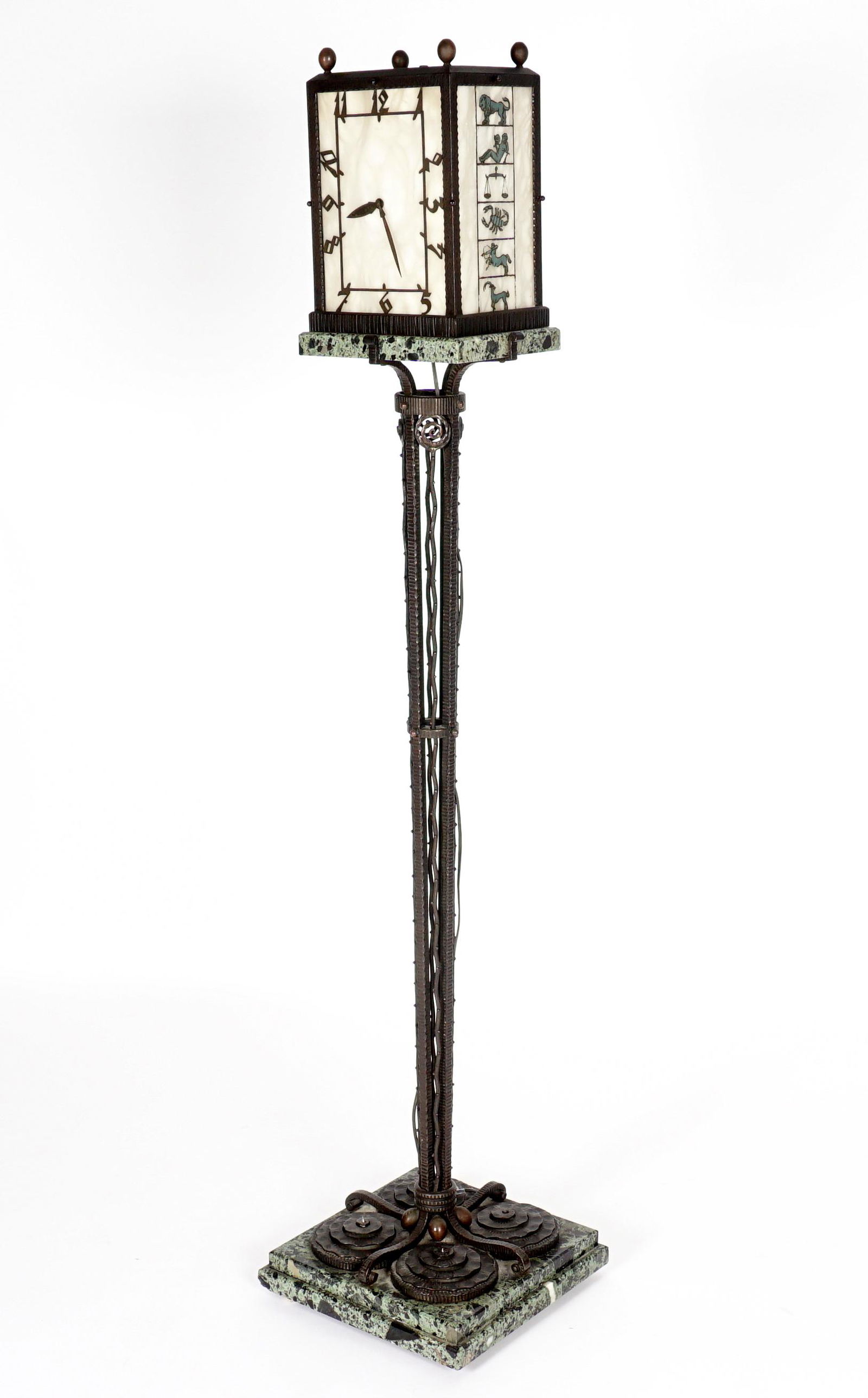 E. Gubelin Art Deco Floor Clock Lamp: Art deco design, dial with pierced metal Arabic numerals, partially marked E. Gubelin, Lucerne. Alabaster inserts, sides with signs of the Zodiac. Openwork support shaft, marble base with four bronze