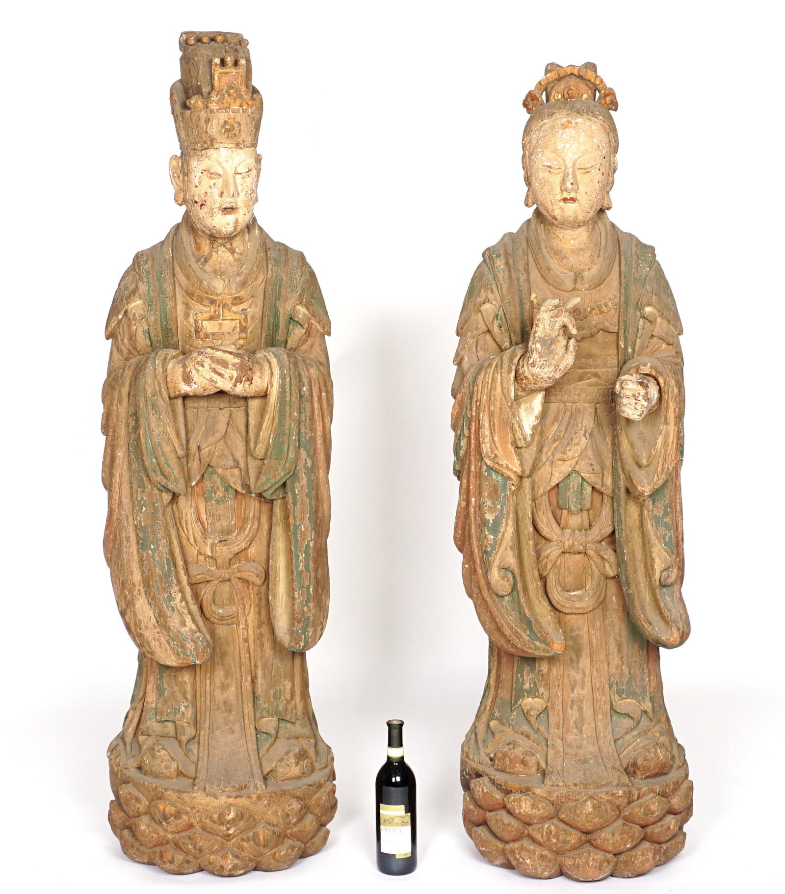 19th C. Pair of Large Chinese Carved Ancestors: 19th Century nearly life size man and woman in royal garb, traces of polychrome paint decoration remains, taller man measures approx. 60.5" h. x 17". Condition: Both with paint flake and loss, cracks,