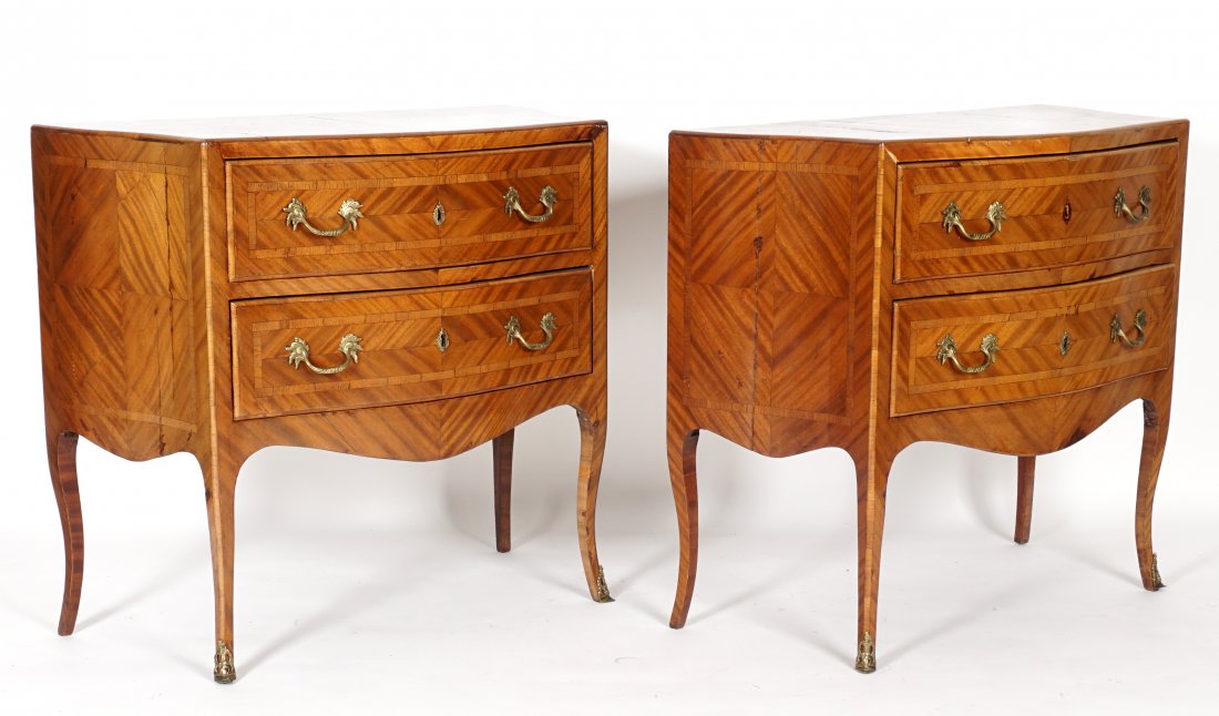 Pair Italian Serpentine Two Drawer Walnut Commodes: 18th/19th century with matched herringbone veneer, diamond central accents and contrasting banding. Case with wide dovetailed drawers, oversized carved brass handles , shaped apron, cabriole legs with