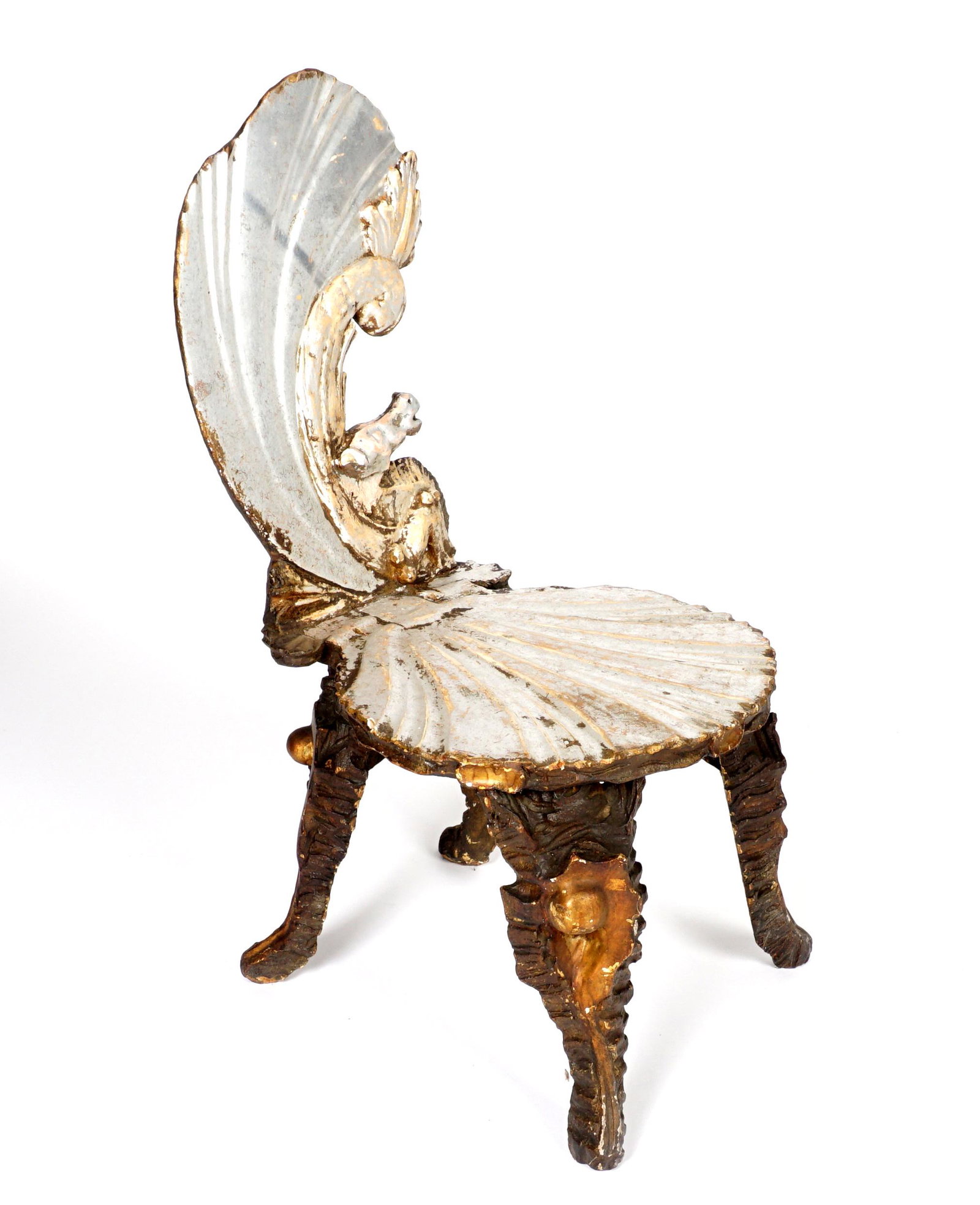 Antique Carved Venetian Grotto Side Chair: Seahorse shell back, shell seat, carved conch shell legs, silver gilt decorated. Overall 34.5 h. x 17" x 21". Condition: Loss and wear to gilt, later added metal support to back.