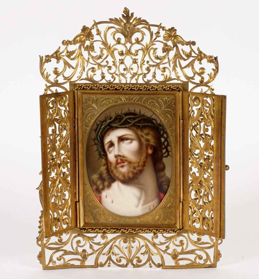 19th C. Continental Porcelain Plaque of Jesus: Oval oil on porcelain plaque depiction of Jesus Christ with crown of thorns, no visible signature. Set in pierced foliate scroll frame, two pierced doors open to reveal plaque, engraved brass frame, s