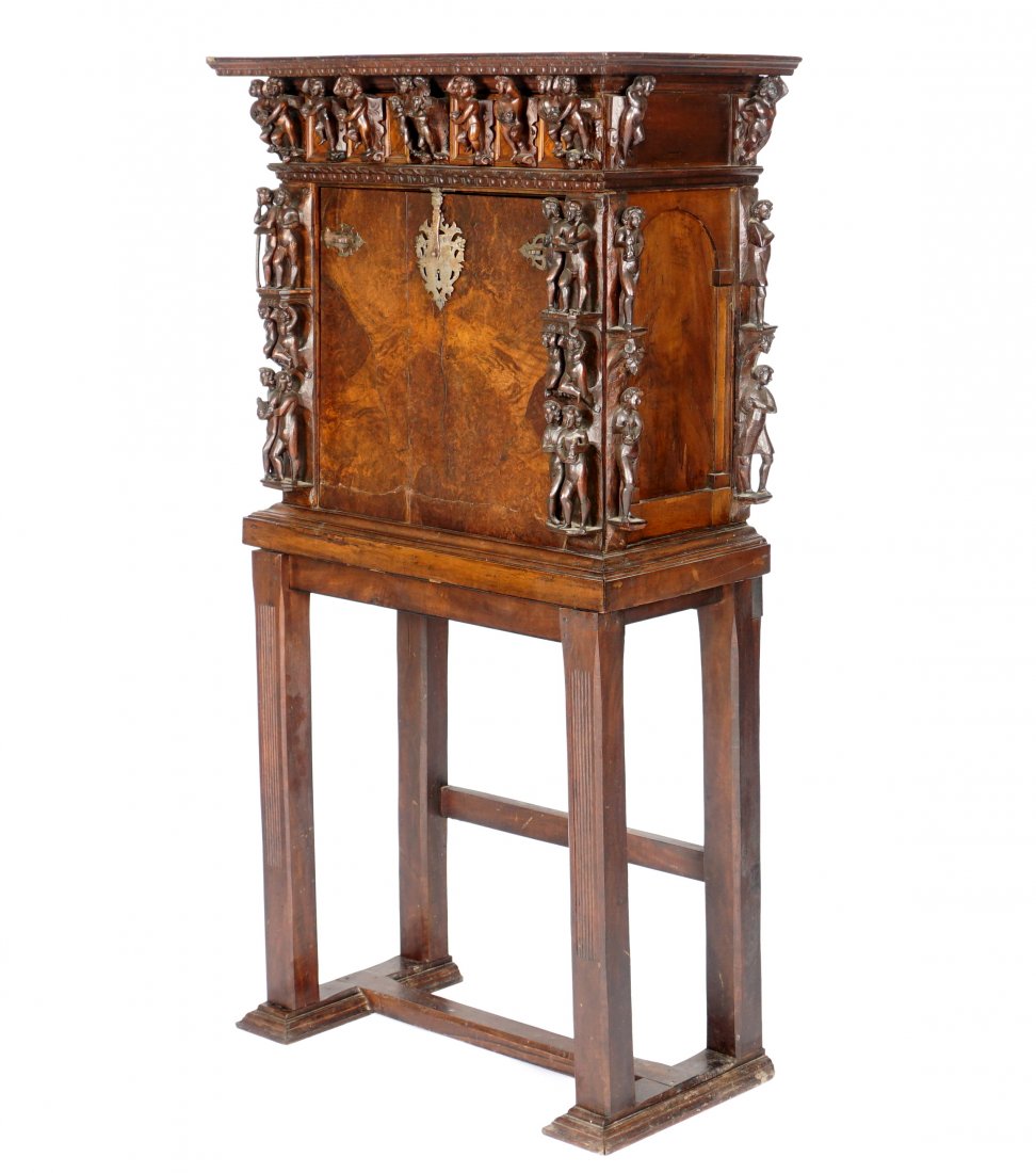 18th / 19th Century Italian Carved Walnut Bambocci: Burl walnut case Italian bambocci cabinet adorned with carved figural putti, men, and women, two hidden drawers over fall front. Front opens to fitted interior with three conforming relieved carved do