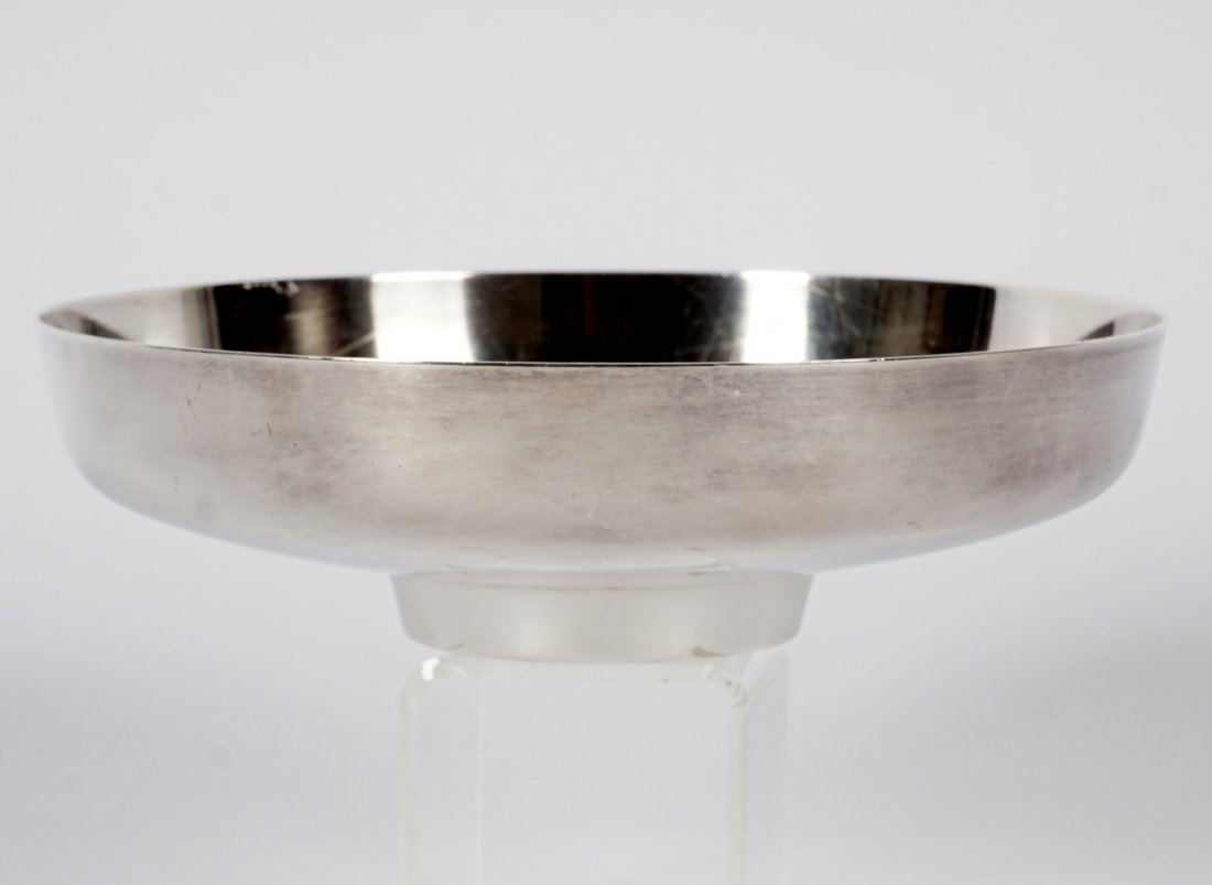 Henning Koppel for Georg Jensen Sterling Bowl: Pattern 1132B, designed by Henning Koppel for Georg Jensen, Denmark, circa 1965. Well marked on base with Dessin, HK in oval, Georg Jensen, Denmark, Sterling. Overall 1.75" h. x 6.5". Condition: Scrat
