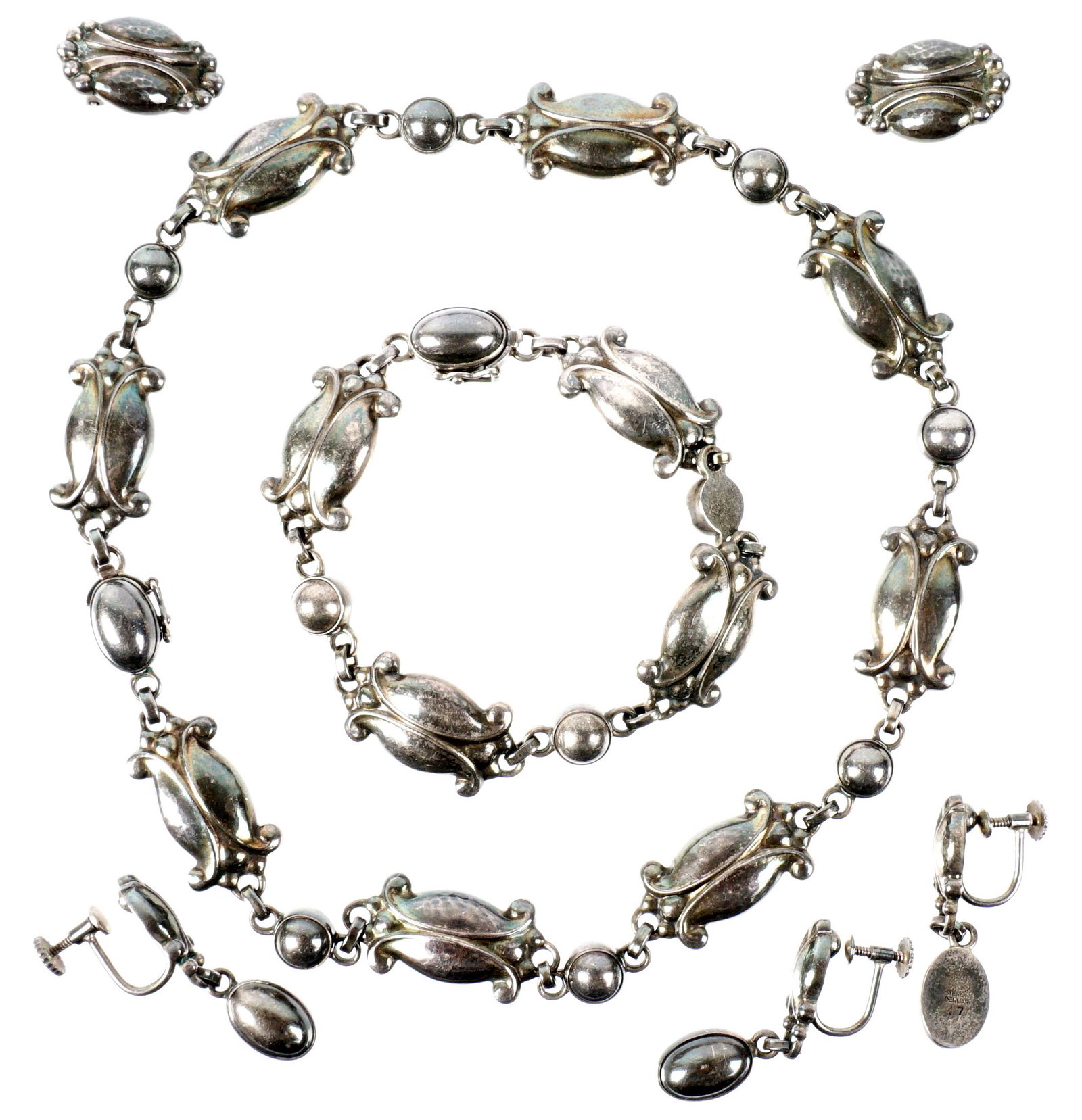 Georg Jensen Sterling Necklace, Bracelet, Earrings: Comprising of a set in the Seed and Pod design, necklace 14.75", bracelet 7.25", three screw back earring drops 1.75". Sold with and additional set of Jensen ear clips 1".