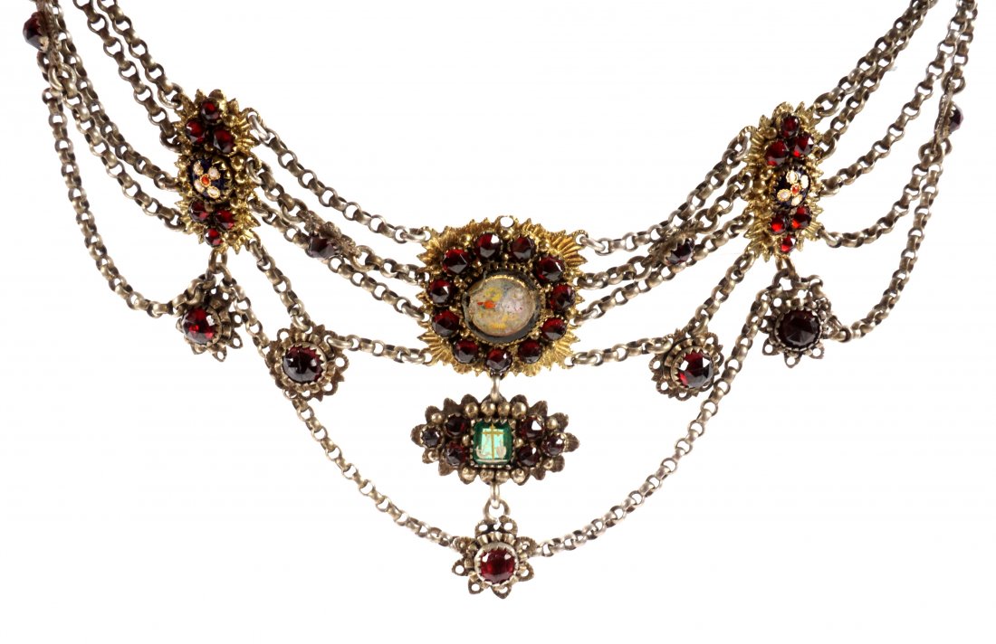Victorian Garnet and Enamel Choker Necklace: Silvered metal choker with four linked bands, embellished with gold toned garnet and enameled decoration. Measures 12" long plus an additional 4" extender. One item of many in an old world collection