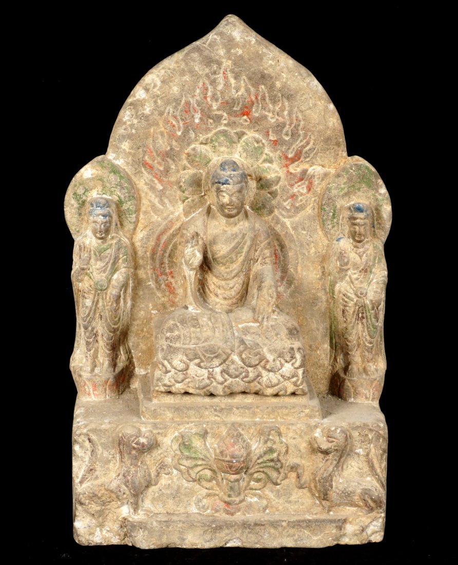 Chinese Carved Stone Figure of Buddha: 19th? Century carved stone figure of a seated Buddha with attendants, temple dogs below, traces of polychrome paint decoration remaining. Overall 16.5" x 10.25' x 5.25". Base chips.