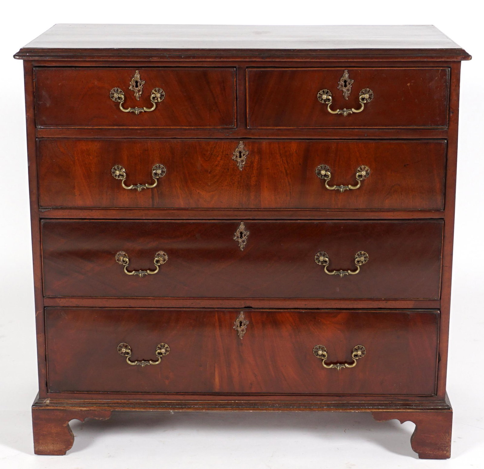 Early 19th C. English Chest of Drawers: Rectangular mahogany top and case, 2 drawers over 3 drawers, brass pulls, bracket feet. Overall 36.5" h. x 37.5" x 20.5". Condition: Scratches and dings to top, other wear consistent with age and use.