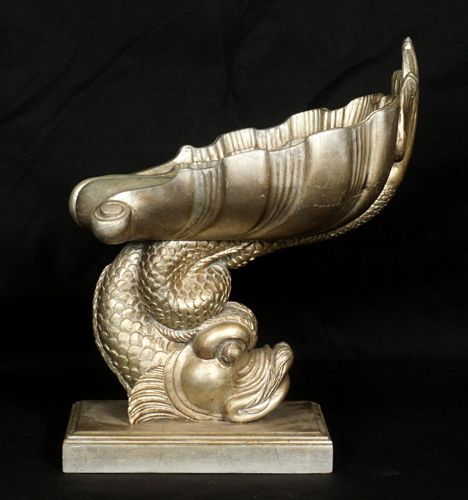 Smith & Watson Silver Gilt Decorated Grotto Stool: Shell form seat over figural dolphin support, rectangular base, Smith & Watson tag on base. Silver gilt / painted decoration. Overall 26.25" h. x 16" x 21". Condition: Wear to gilt, scratches.