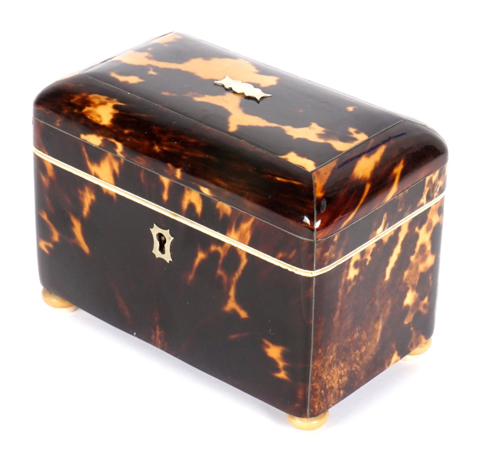 English Regency Tortoise Shell Tea Caddy: Rectangular case with rounded hinged lid, two interior compartments, on four bun feet, overall 4.5" h. x 6" x 3.5". Condition: Scratches. One item of many in an old world collection from the father of