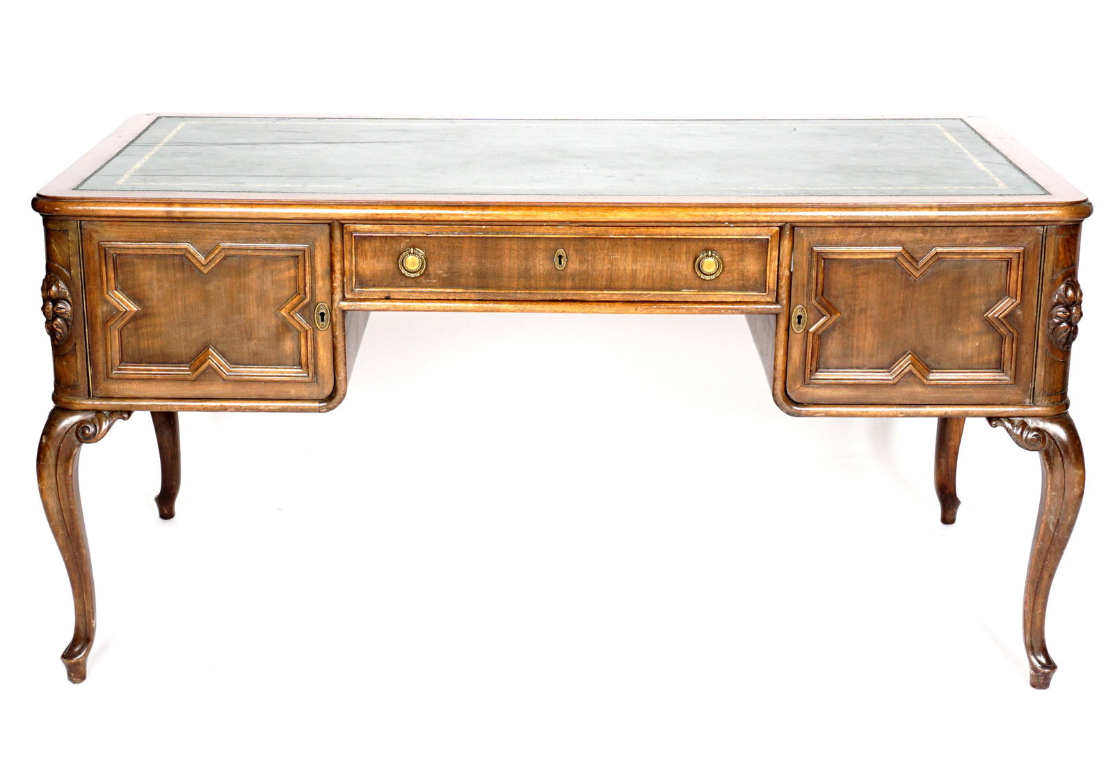 20th Century Leather Top Bureau Plat Desk: Embossed inset green leather top, center drawer, left door with single fixed shelf, right door with two slide out shelves, overall 30.75" h .x 62" x 32". Condition: Scratches to top, other wear consis