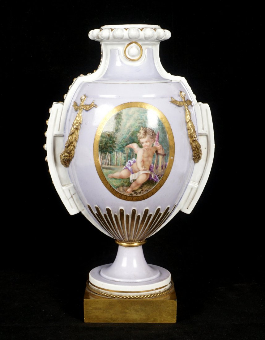 19th Century Neoclassical Porcelain Urn on Stand: Lavender hued ground, hand painted cherub with lyre in landscape reserve, floral spray verso. Applied gilded boughs and Greco-Roman handles. Round foot affixed to square brass base, with rope twist ac