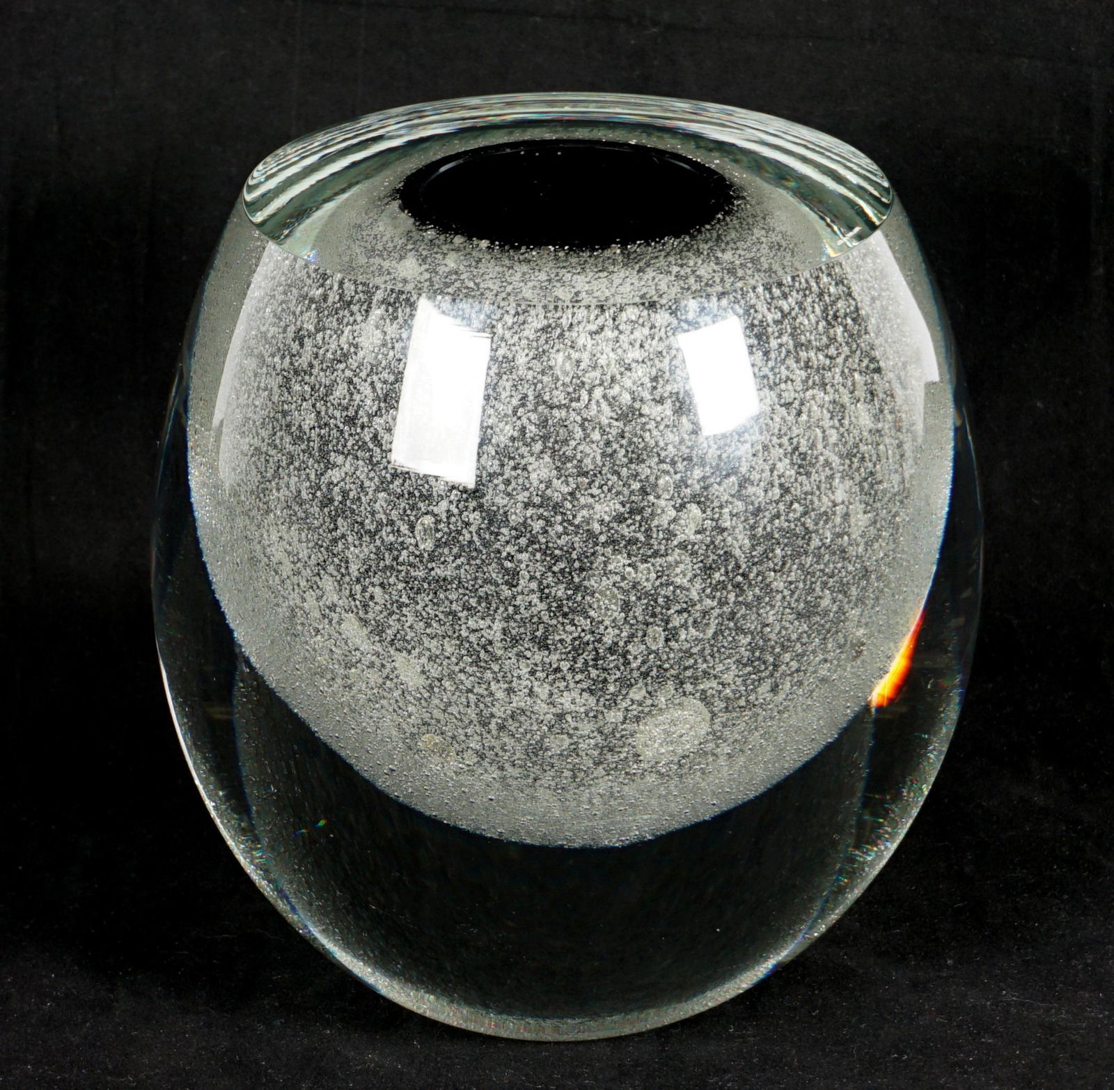 1982 Timo Sarpaneva Claritus Art Glass Vase: Control bubble covered internal black glass, clear glass exterior casing, base signed Timo Sarpaneva and dated 3/1982, partial Made in Finland sticker on top. Overall 8\" h. x 7.5\" dia. Condition: Gr