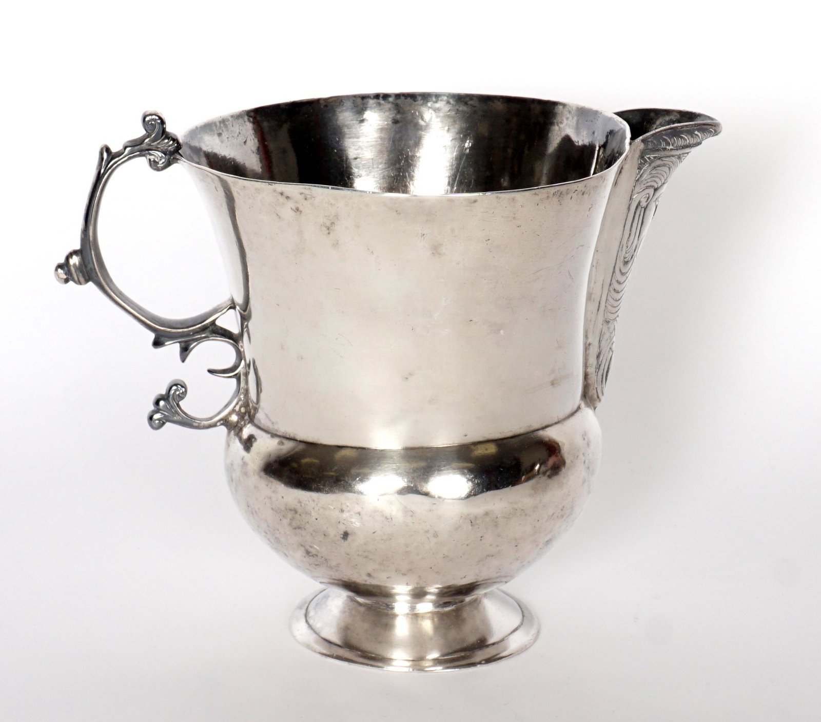18th C. Spanish Colonial Silver Jarro de Pico: 18th Century Jarro de Pico pitcher, bearded man spout, scroll handle, owners name inscribed in base. Overall 5.5" h. x 7". Approx. 14.5 troy oz. Condition: Dings, slightly askew.