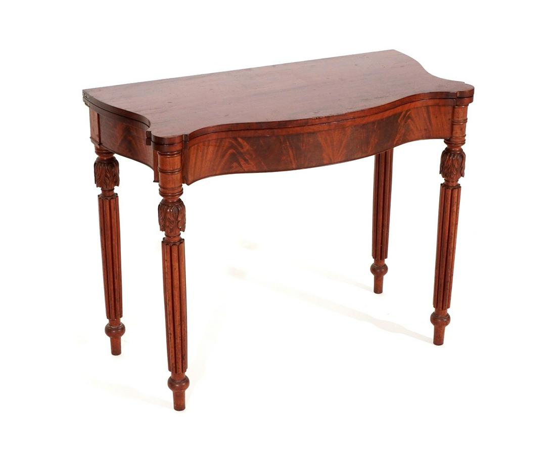 19th Century Federal Mahogany Game Table: Circa 1830, serpentine lift top, carved and fluted legs with gate leg, overall 30" h. x 37.5" x 19". Condition: Scratches and abrasions to top.