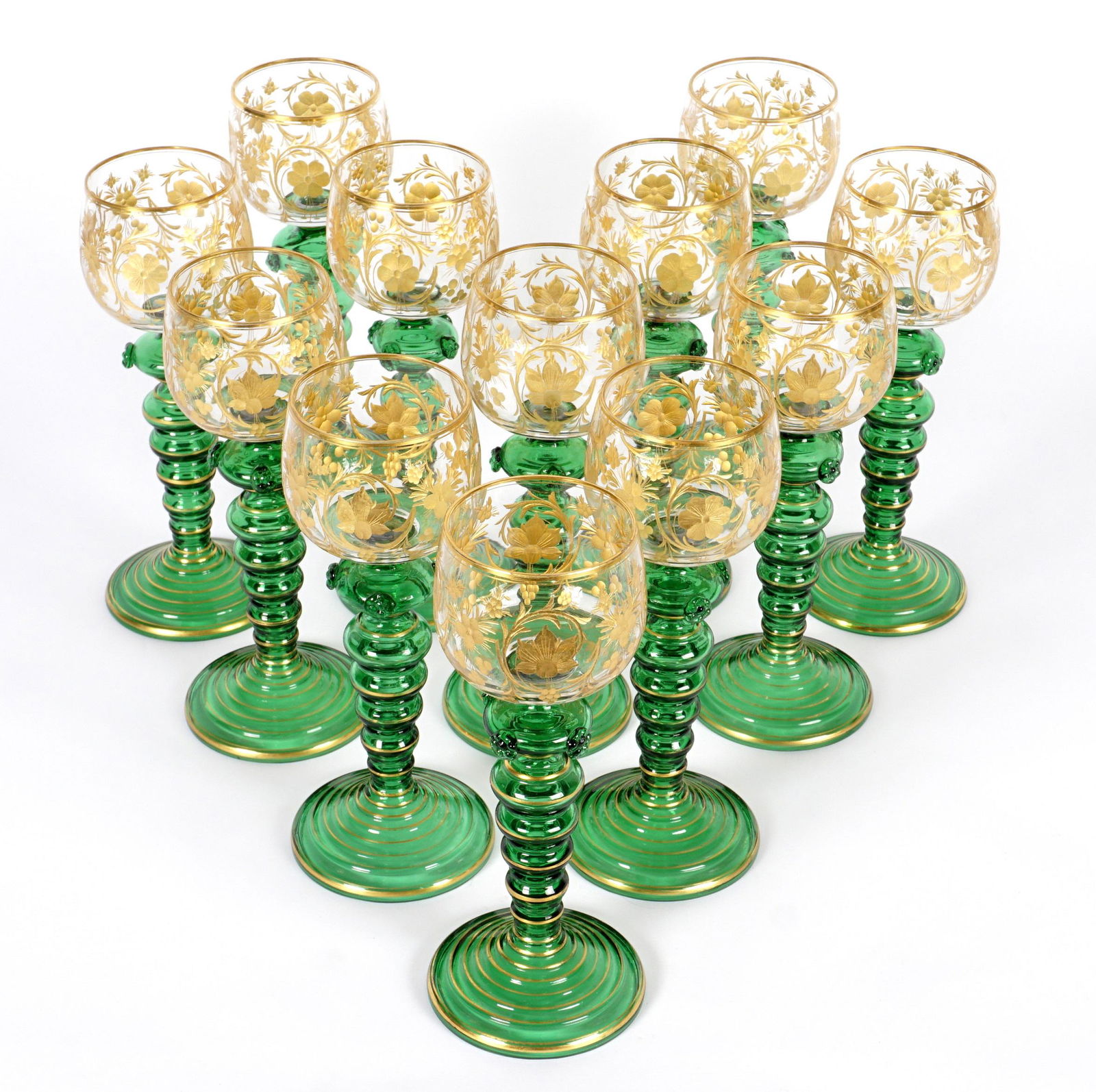 Set of Twelve Moser Gilt Decorated Wine Goblets: Etched gilt floral motif clear glass bowls over green ribbed base, gilt accents, overall 7.5" h. x 3" dia.