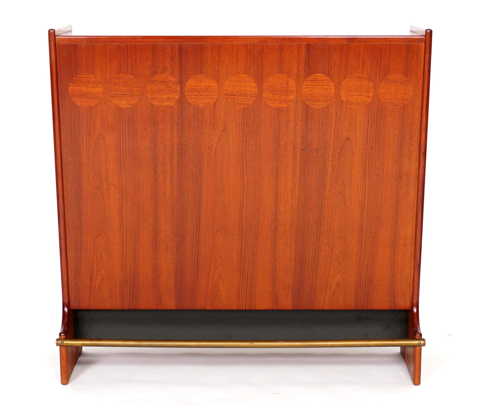 Johannes Andersen Teak Mid Century Bar: Teak with round parquetry accents, hinged lift top and fall front opens mirrored interior with bottle storage over sliding door with center shelf and tray, lower door opens to bottle storage, brass fo