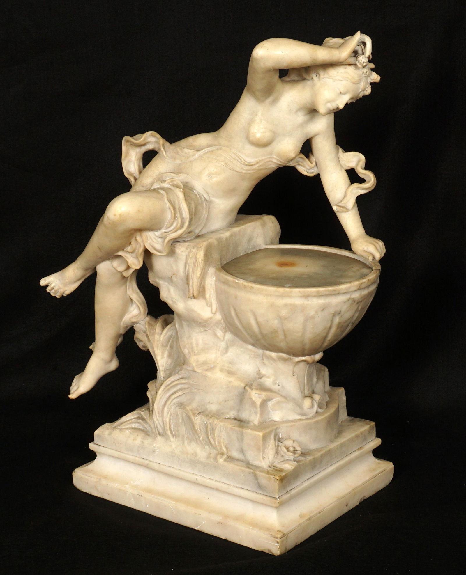 Adolfo Cipriani Alabaster Lamp Woman at the Well: Art Nouveau figure of art nouveau woman peering into a wishing well, lamp fixture inside well, signed A. Cipriani, 24" h .x 17" x 12.25". Condition: Scratches, missing finger, minor chips, in need of