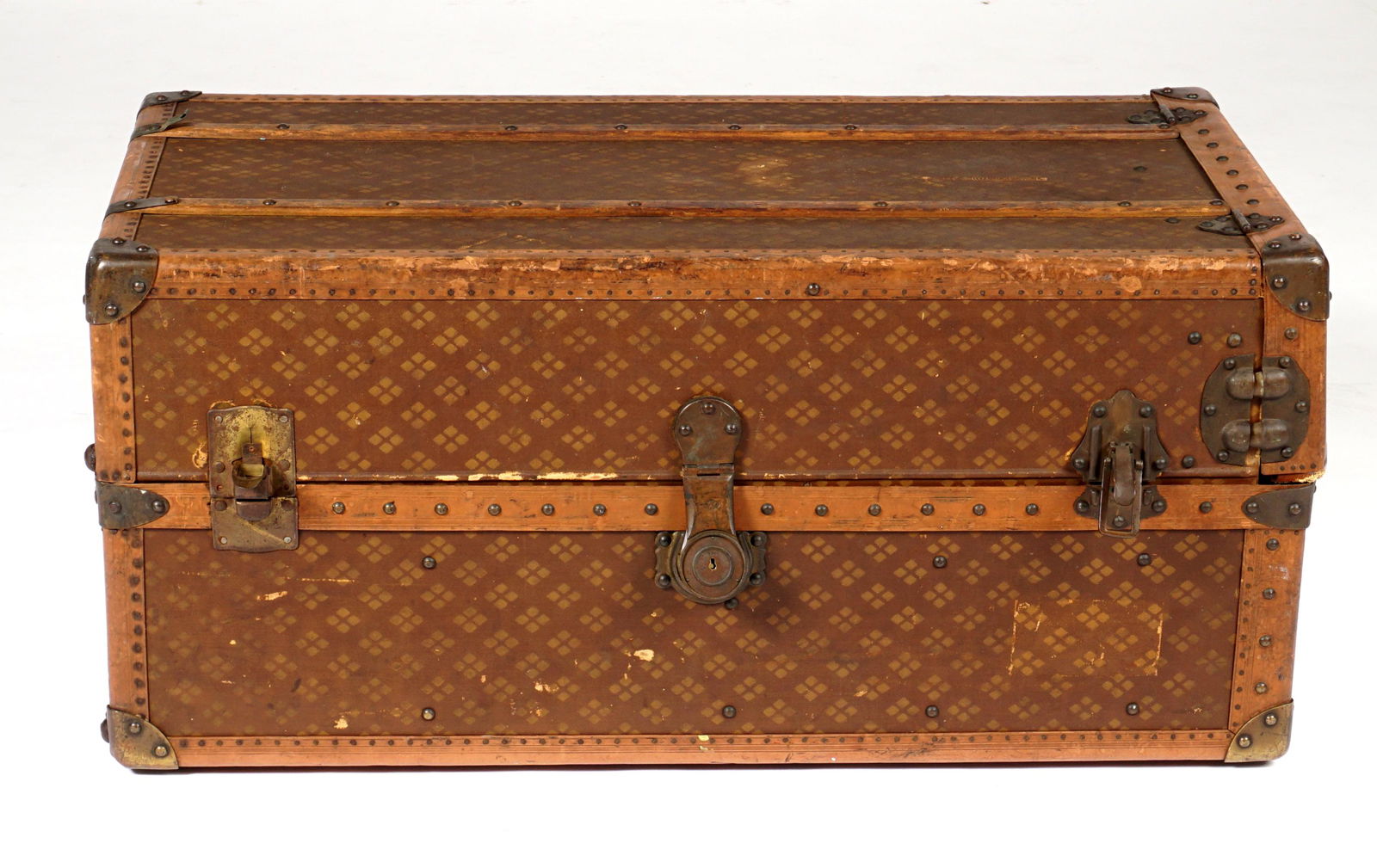 Vintage Aux Etats Unis French Steamer Trunk: Patterned canvas exterior, tacked wood borders and slats, brass hardware and mounts. Interior with five graduated drawers, shirt rack, and shoe bags. Overall 40.5" h. x 21.5" x 18". Condition: Scratch
