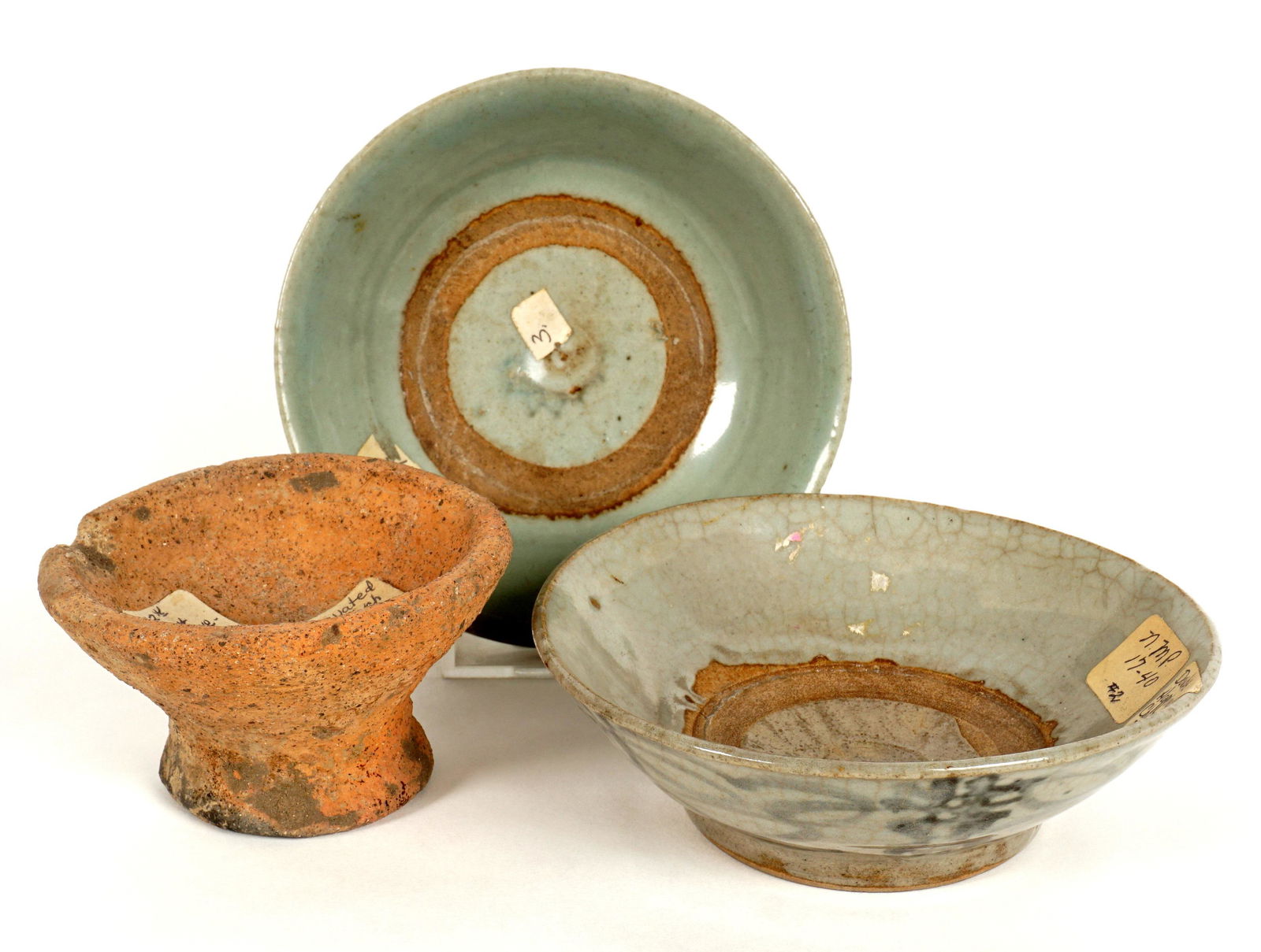 Three Piece Singapore and Philippines Earthenware: An assembled collection of three pieces total to include 1-2) Two 17th-19th Century celadon Singapore Ware bowls, each with blue decoration on exterior and bearing a National Museum of Philippines pap