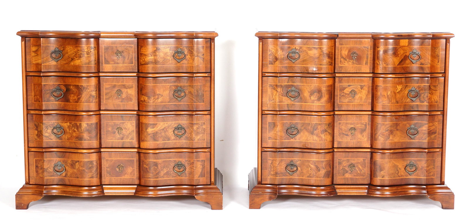 Pair Contemporary Italian Serpentine Commodes: Serpentine tops, burl veneer panel, conforming four drawer case, bracket feet. Marked on back Decorative Crafts Inc., Made in Italy. Overall 37.25" h. x 41" x 19.25".