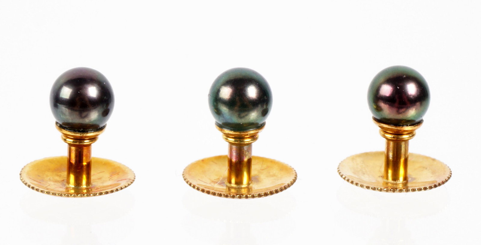 Asprey 18k Gold & Black Pearl Shirt Studs: Three 18k yellow gold shirt studs with black pearls, sold in fitted Asprey PLC box. 12mm long, pearls 5mm. One pearl appears to have been reset.