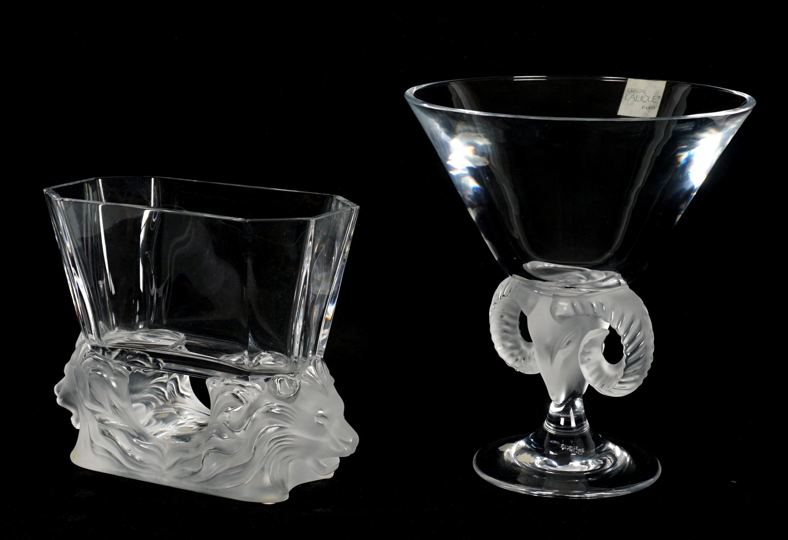 Two Lalique Crystal Vases: Two pieces total to include 1) Aries rams head vase, 8.75" h. x 7.75" dia. 2) Double lion head vase, 6.5" h. x 8.25" x 3.5".