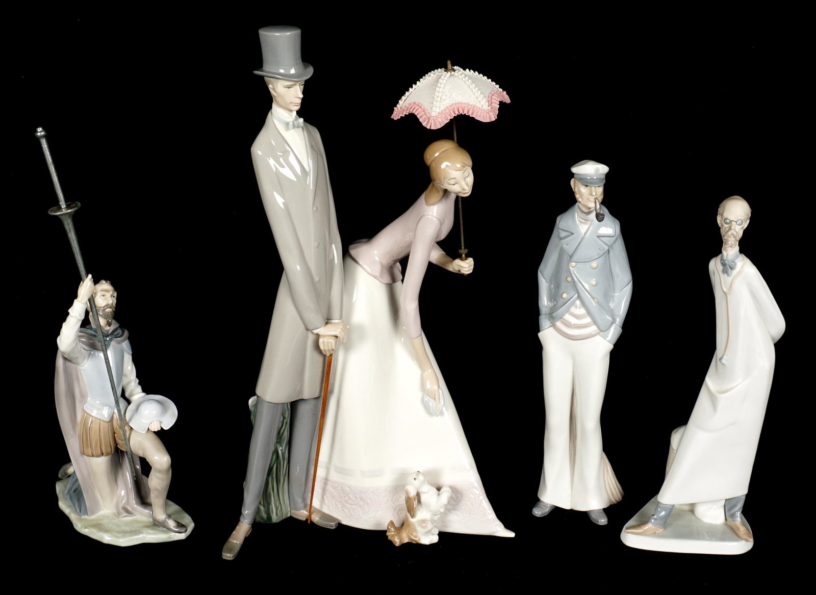 Four Lladro Porcelain Figurines: Four pieces total to include 1) Doctor, #602, 14" h. 2) The Quest, #5224, 14.5" h. 3) Sea Captain. #4621, 15"h. 4) Couple with Parasol, #14563, 20" h. x 11.5" x 6.5". No boxes or condition issues note