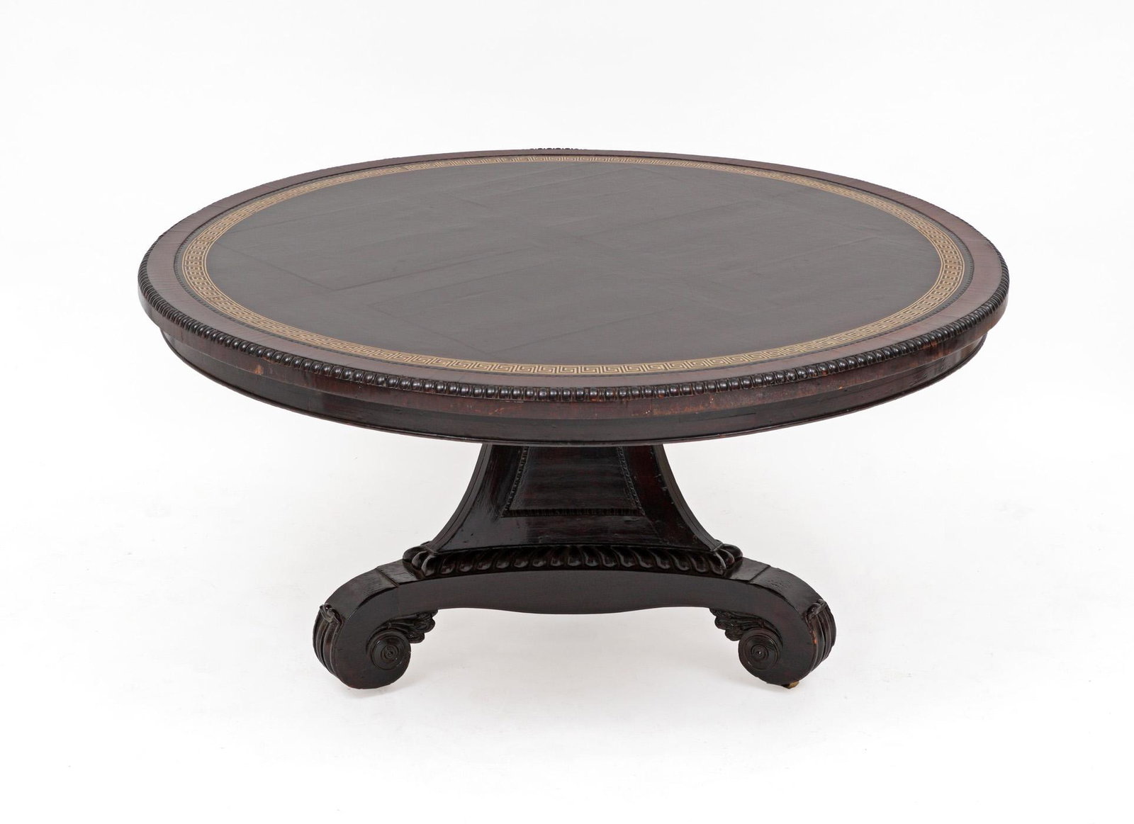 English Georgian Center Table: Possibly Irish, round top with gilt Greek key embossed leather insert, gadroon trim. Carved splayed tri-foot base ending in scroll feet, overall 33.75" h. x 61" dia.