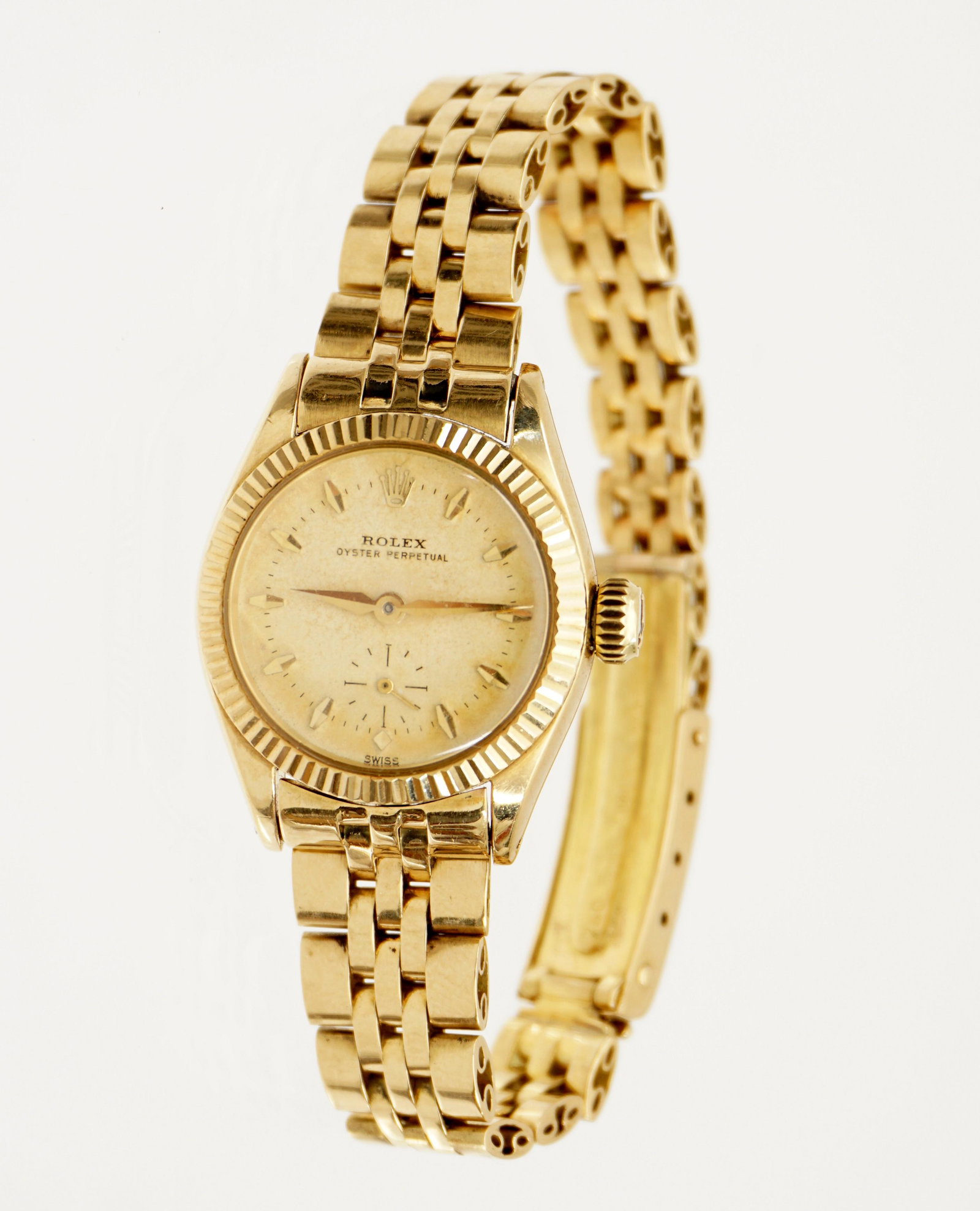 Ladies 18k Rolex Oyster Perpetual Wrist Watch: Ladies Rolex wrist watch, 18k gold bracelet, 24mm case excluding crown, no box or papers, 49 grams inclusive. Condition: Signs of wear, scratches to crystal, currently running however not guaranteed t