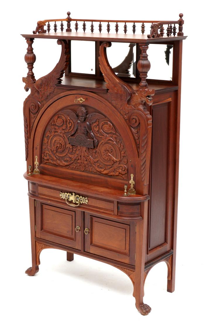 Attrib. Horner Bros. Carved Cherry Secretary Etagere: Attributed to Horner Brothers, open shelf top with stick and ball gallery, carved and turned support over figural winged griffins, beveled glass mirror backsplash. Arched fall front secretary door, ca
