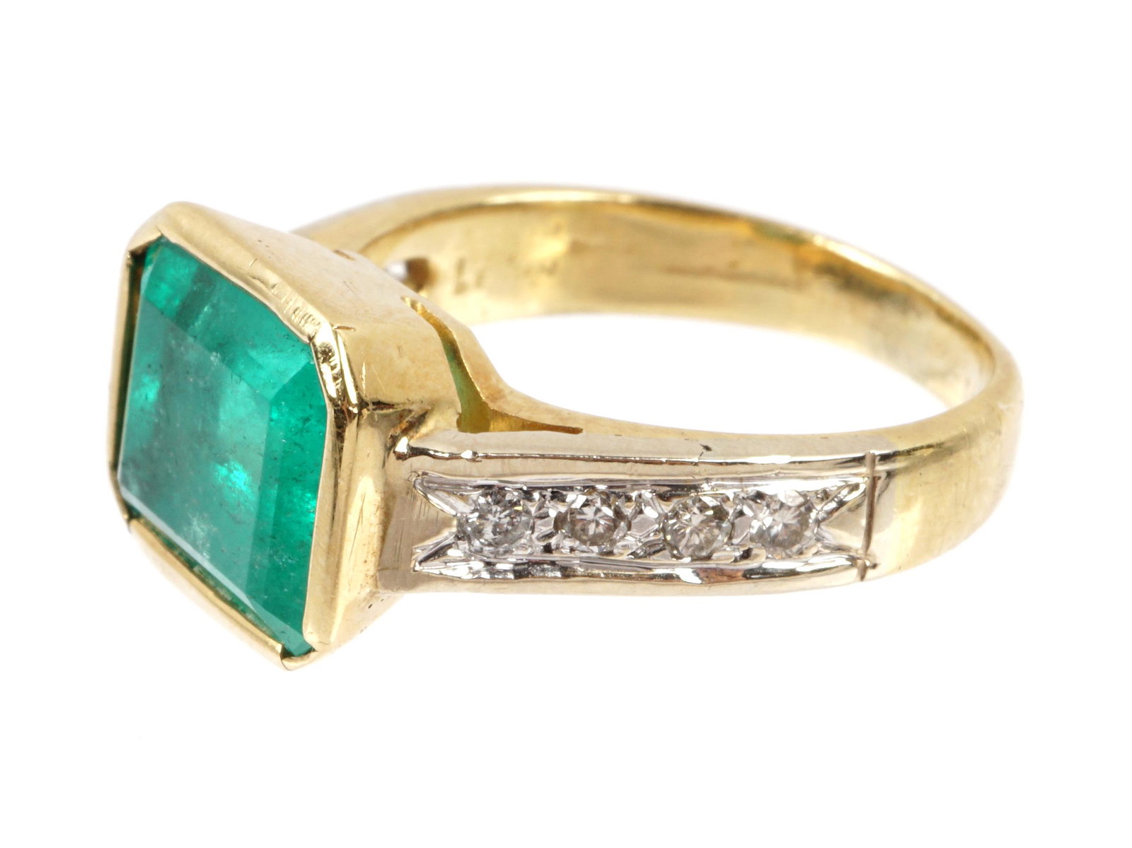 18k Yellow Gold, Emerald, and Diamond Ring: 14k yellow gold band marked Levian, center bezel set emerald cut emerald, approx. 4.33ct. 8 bead set round brilliant cut diamonds, approx. .16ctw. Approx. 6.6 grams, size 6. Sold with 2021 appraisal o
