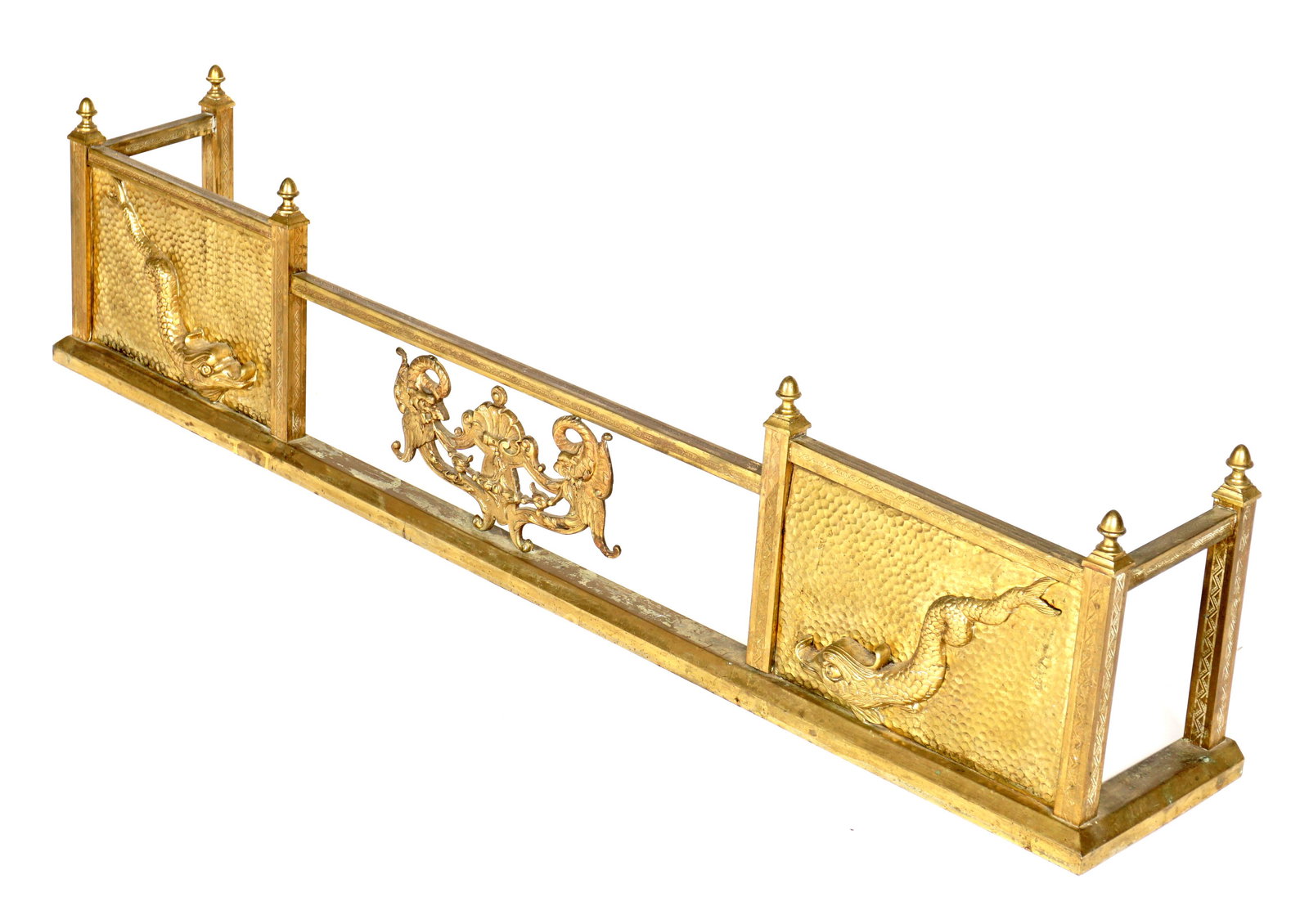 Figural Dolphin Brass Fireplace Fender: Center cast bronze centerpiece with shell and serpents, flanked on either side with embossed hand hammered figural dolphin, six finials, overall 12.25" h. x 54" x 9". Condition: Spotting to brass.