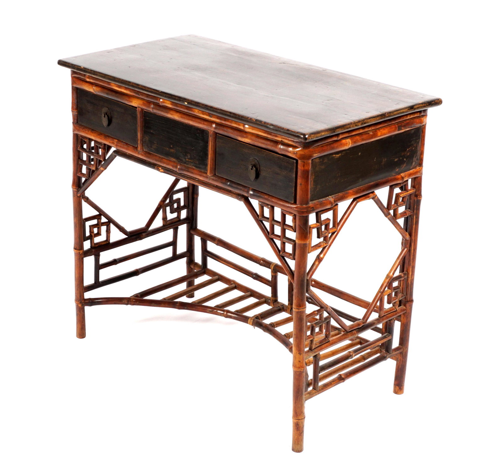 Victorian Bamboo Writing Desk: Ebonized rectangular top and sides, two front drawers, bamboo base, skirt, and lower open stretcher shelf, overall 32" h. x 35" x 19". Condition: Scratches, abrasions, and wear.