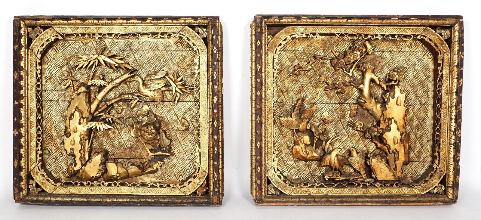 Pair Chinese Qing Carved Gilt Wood Wall Panels: Large Qing Dynasty relieve carved wall panels with gilt accented birds and branches motifs, each panel measures 35" h. x 37.75" x 6". Condition: Loss of decoration.