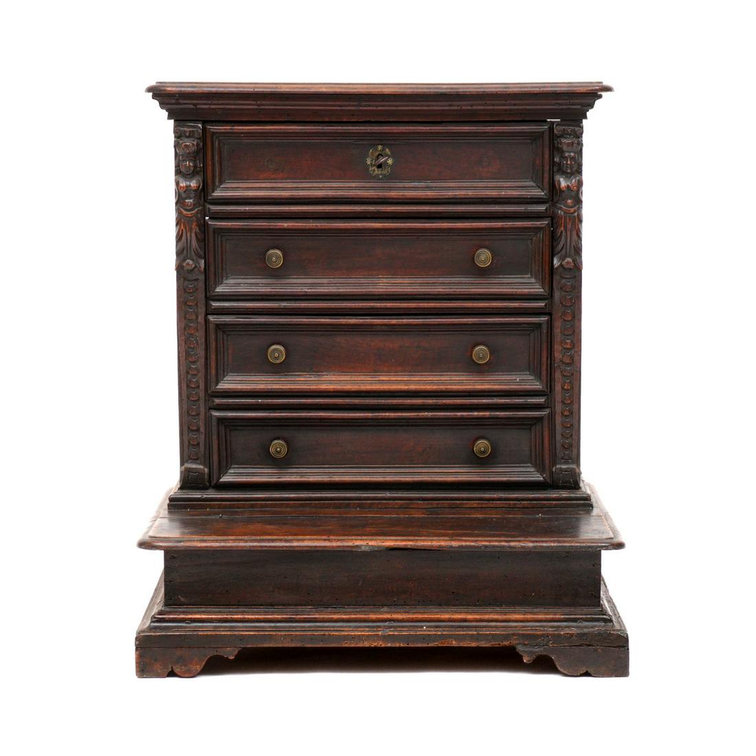 18th C. Italian Carved Walnut Prie Dieu Cabinet: Rectangular top over four drawers, figural carved stiles, lift top base with open storage, overall 35.75" x 29.75" x 23". Condition: Age splits, other wear consistent with age and use.