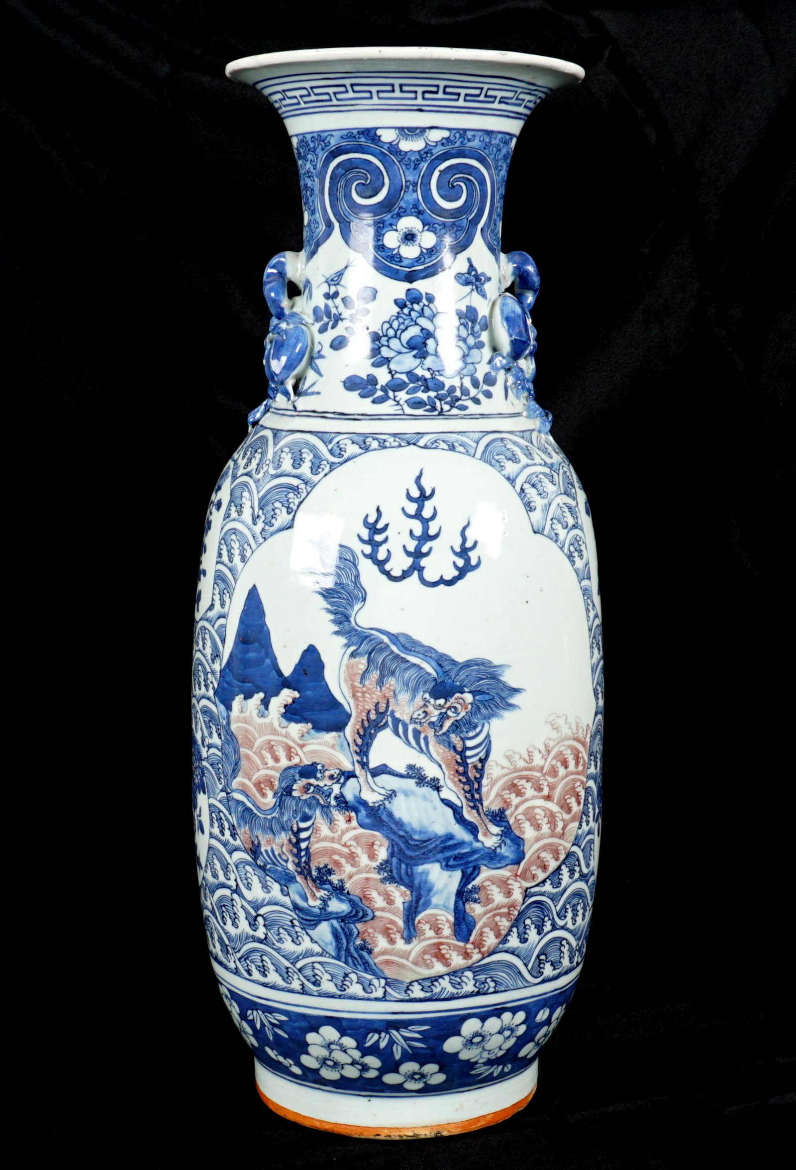 Chinese Polychrome Decorated Floor Vase: Baluster form floor vase, applied fruit handles; white ground with blue and red underglaze decoration, floral and crashing waves; Qilin in landscapes in reserves. Paper labels on base, overall 23.75"