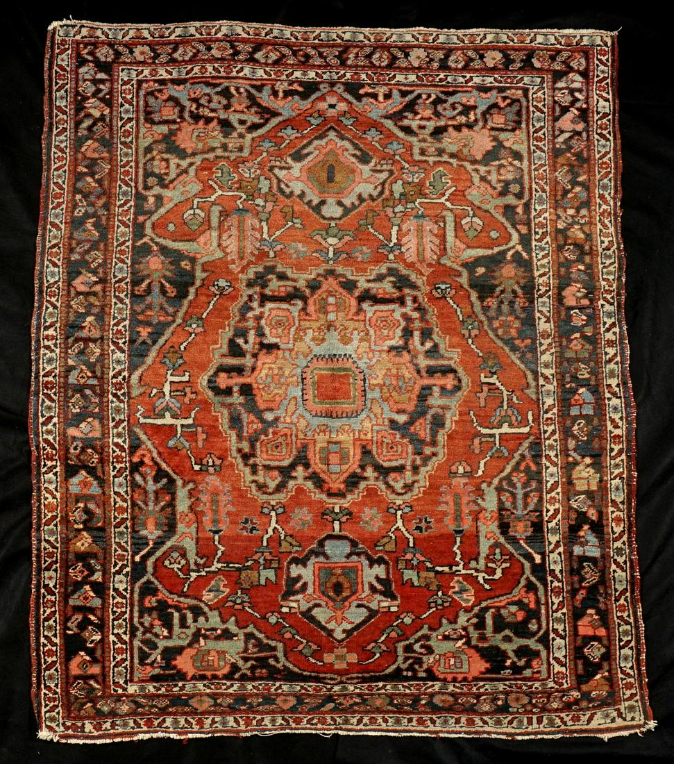 Antique Persian Heriz Hand Knotted Wool Rug: Rust red center field bordered with black side fields, floral and geometric motifs, 54" x 66". Condition: Wear and fading.