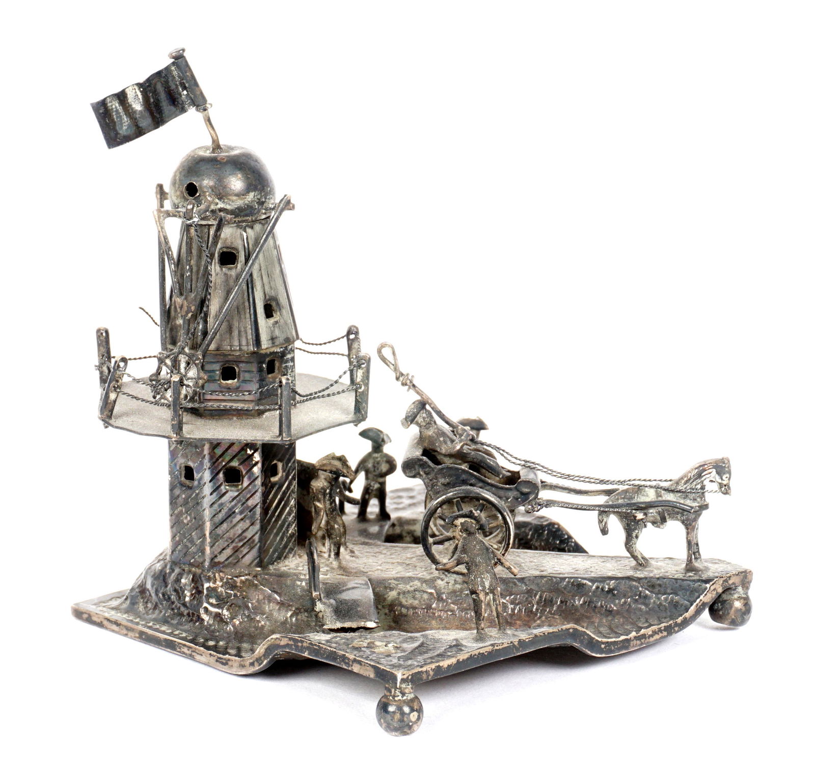 19th Century Dutch Silver Figural Windmill: Windmill with figures, bridge, cart with horse, hallmarked on riverbed and windmill walkway, overall 4" h. x 3.25" x 3.25". Condition: Missing blades to windmill.
