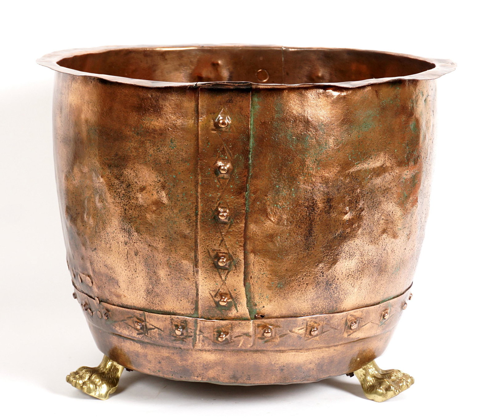 A & L 10 Gallon Hand Wrought Copper and Brass Pot: Flared rim, hand wrought riveted body with engraved decoration on rivet bands, all on 3 paw brass feet. Marked A & L 10 Gallon on lip. Overall 15" h. x 18.75" dia. Condition: Dents and dings.