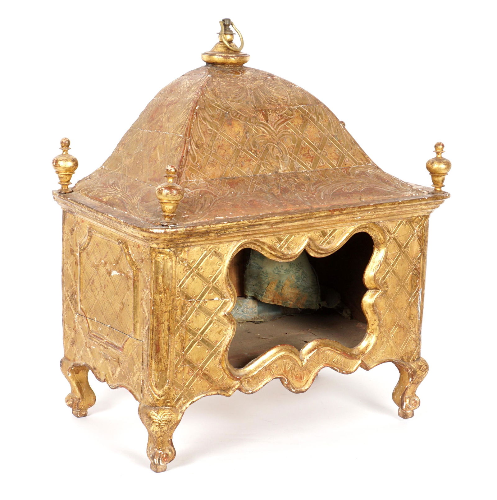 Antique Italian Gilt Wood Table Reliquary: Profusely carved all over, domed top with brass ring finial, turned finials at corners, shaped front opening, serpentine skirt, signed Amedeusm, shaped legs. Overall 22" h .x 18.5" x 10.5". Condition: