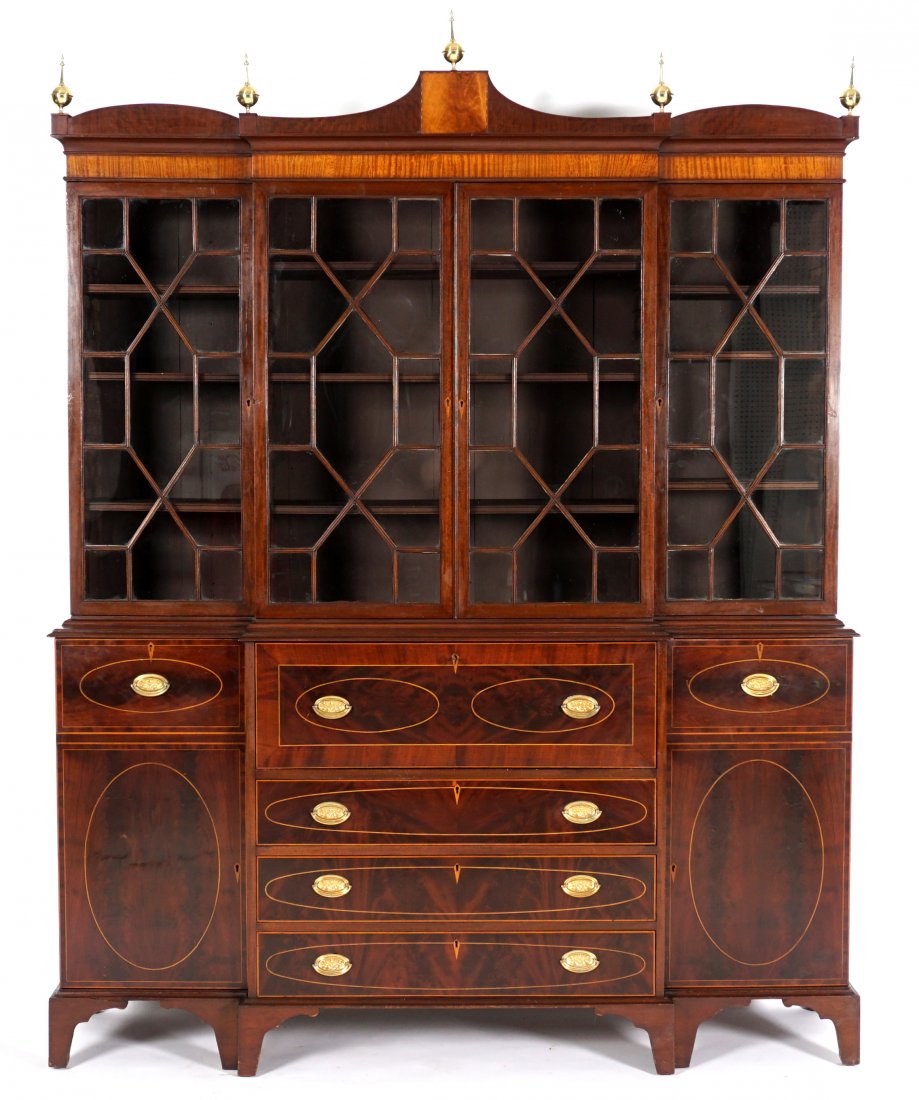 American Federal Inlaid Secretary Bookcase: Circa 1800, American, possibly Pennsylvania, breakfront mahogany case with fruit wood string inlay, shaped crest with brass spire finials, adjustable top shelves. Center fall front secretary drawer wi