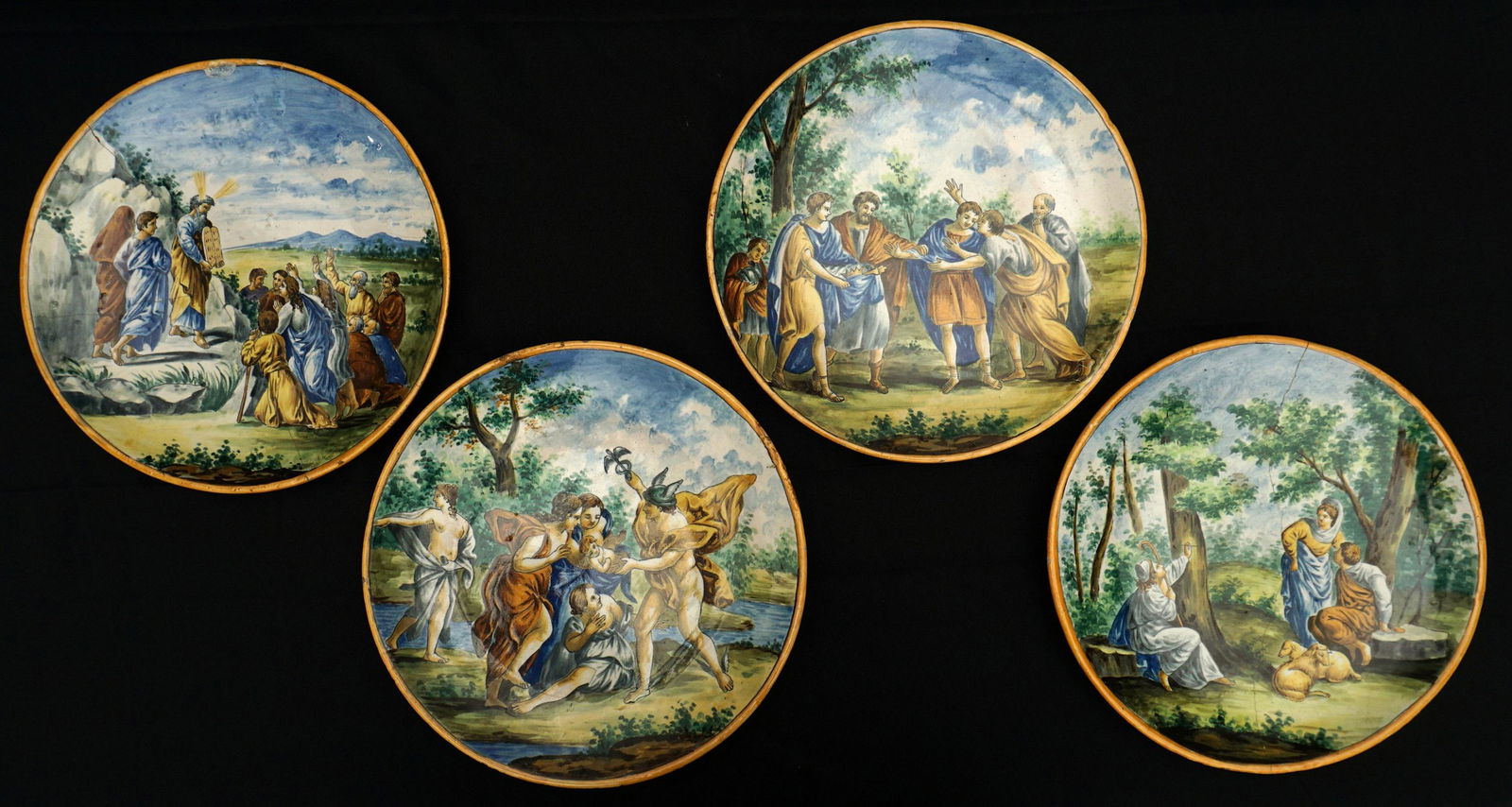 4 Antique Italian Urbino Istoriato Majolica Plates: Each polychrome decorated with neoclassical and religious scenes including Moses and the en Commandments, no markings, 12" dia. Condition: Each with chips, one with old staple crack repair, another wi