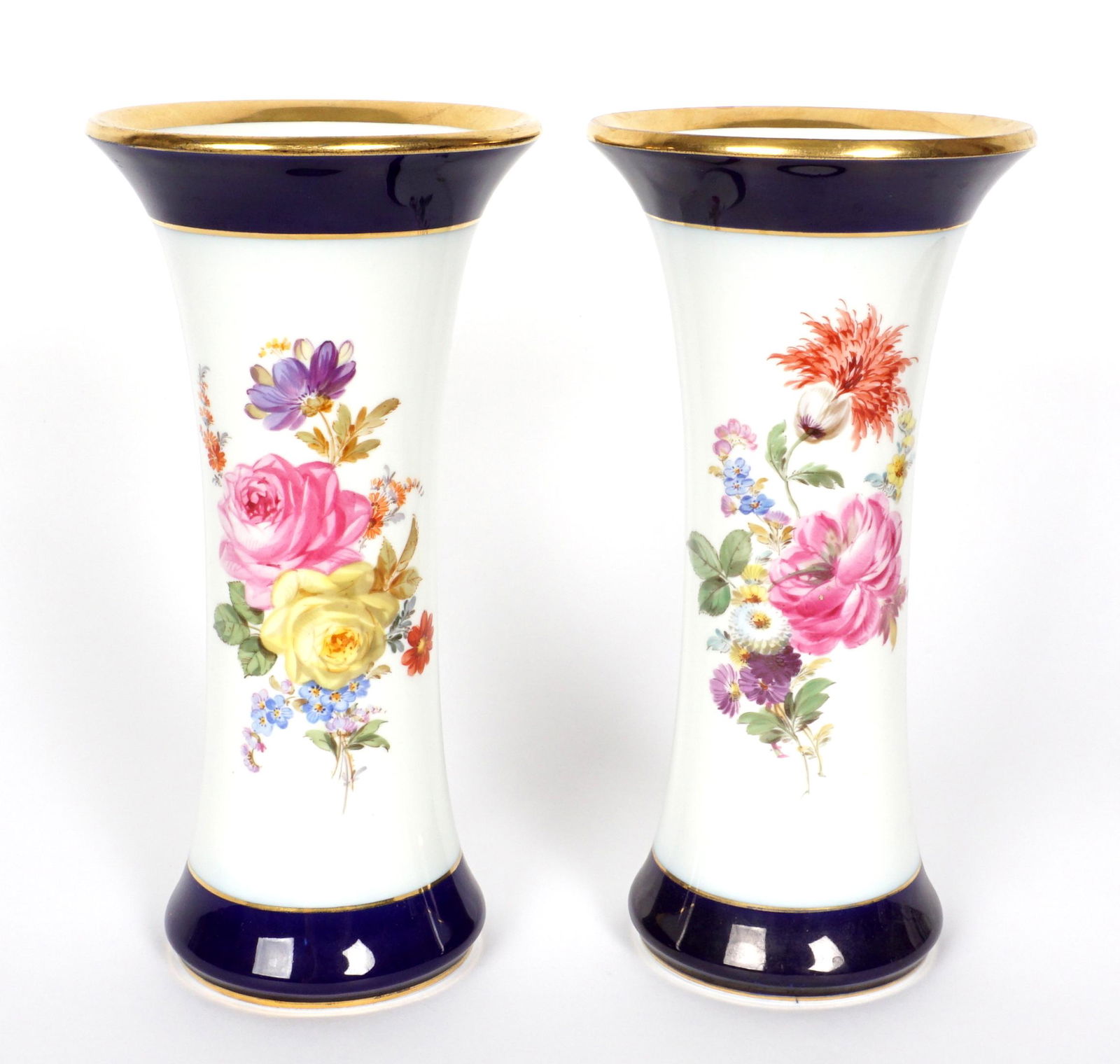 Pair Meissen Hand Painted Floral Vases: Pair vases with floral decoration, flared rims with gilt edge, cobalt band, blue underglaze crossed swords mark on base, 9.75" h. x 5".