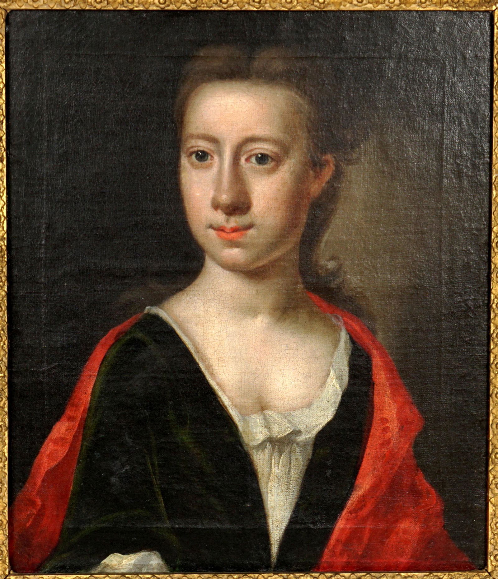 18th/19th Century Portrait of a Woman: Half length portrait of a woman in dress with a red shawl, Oil/Canvas laid on Masonite, no visible signature, 14" x 12", framed 19.5" x 17.5". Condition: Scattered inpaint, craquelure.