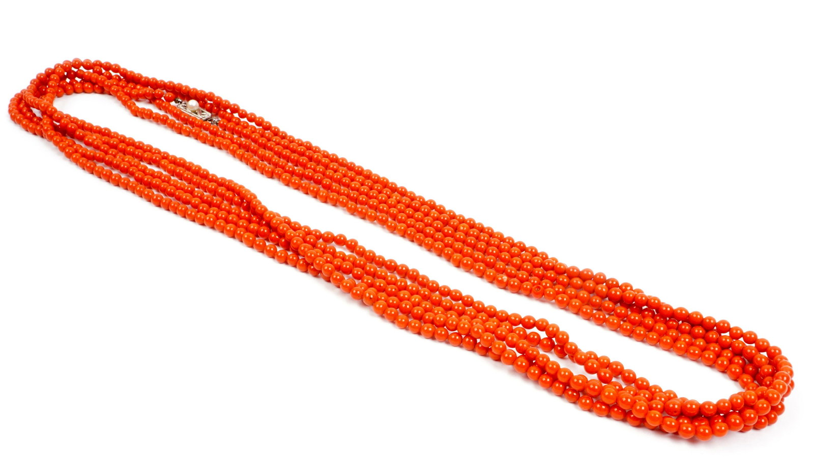 Long Coral Bead Necklace with Mikimoto Clasp: Filigree 14k white gold Mikimoto clasp with single pear, 118" long coral bead necklace.