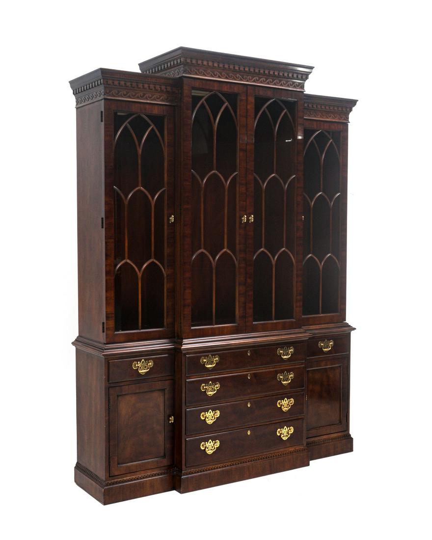 Henredon Rittenhouse Square Mahogany Breakfront: Rittenhouse Square Collection by Henredon breakfront china cabinet, dentil molding over rolling waves, four arched fretwork glass doors, illuminated interior with adjustable shelves. Base with four gr