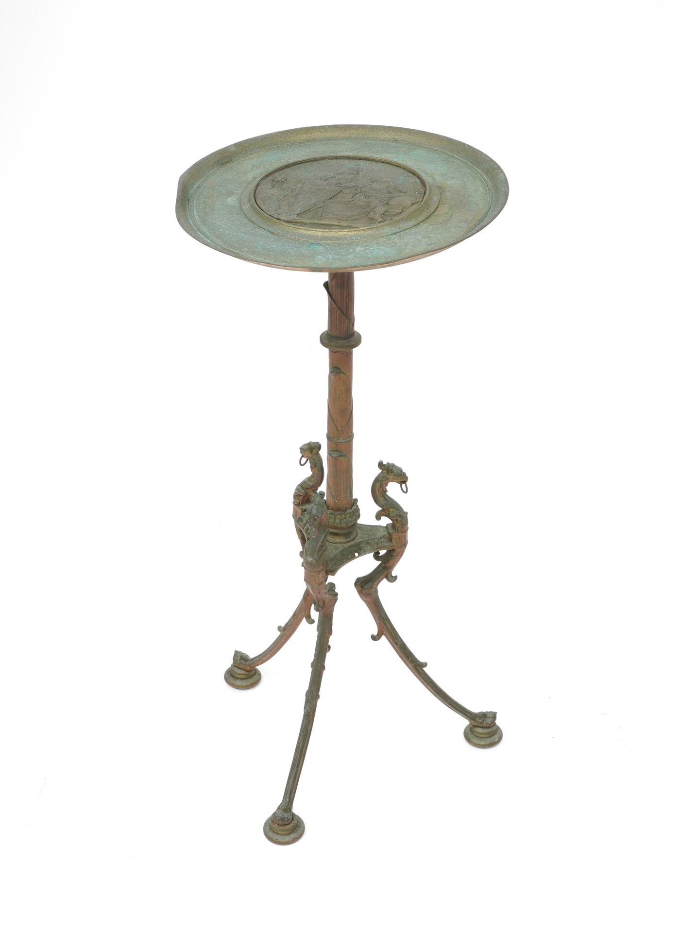 Antique Grand Tour Picault Bronze Side Table: Round top with center plaque depicting Olympias XCI by E. Picault and dated 1863. Papyrus form shaft post, figural dragons over three splayed legs. Overall 31.75" h. x 14.75" dia. Condition: Verdigris